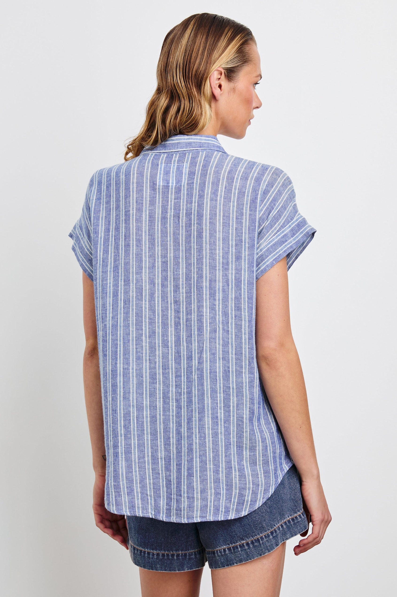 Cito Short-Sleeve Button Down with two Chest Patch Pockets in Lake View Stripe Colorway, Vertical Stripes in Blues and White - Back Untucked View Featured on Model