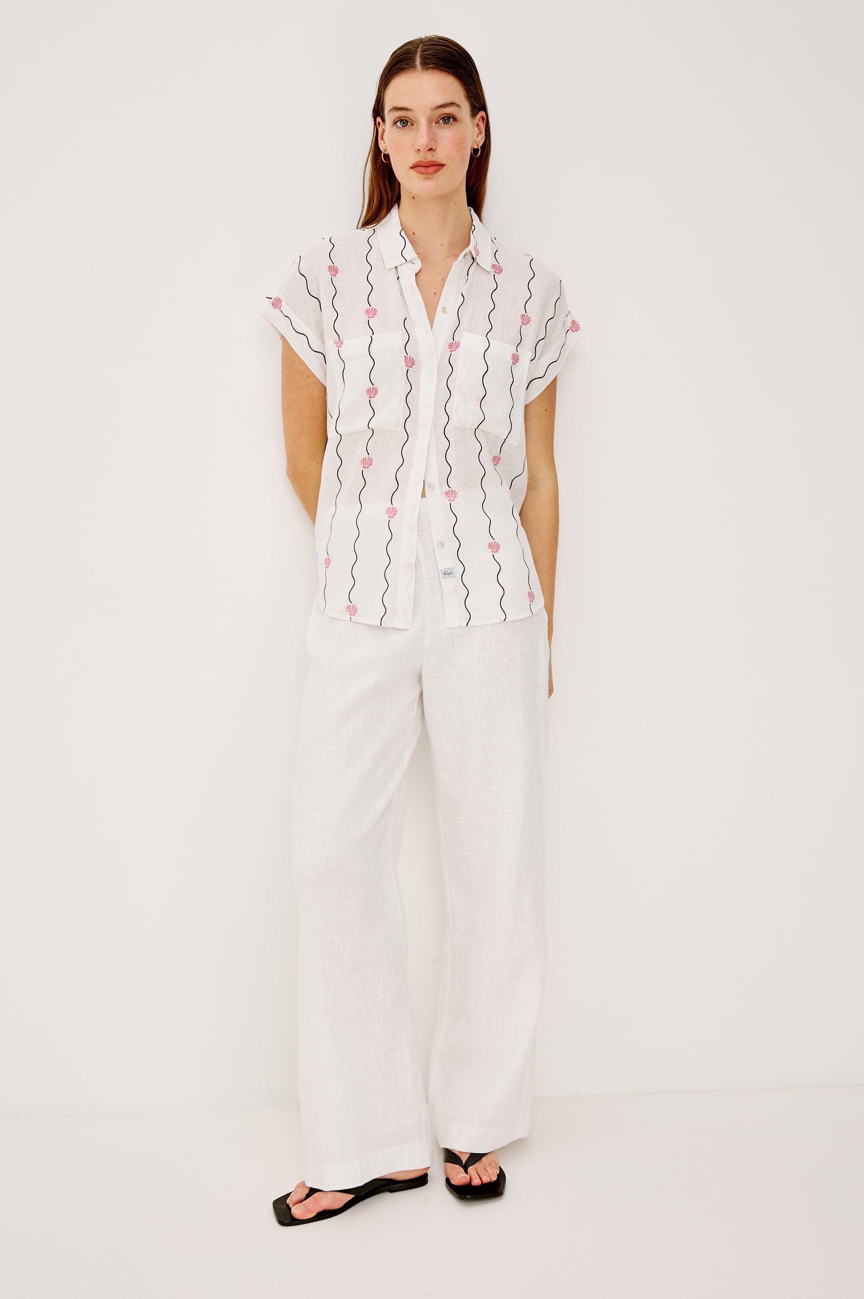 Cito Relaxed Button-Up Shirt in Linen With Collar Chest Patch Pockets and Cuffed Cap Sleeves in Striped Seashells Colorway - Upper Body Front View Featured on Model