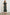 Clementine Midi Dress with a Deep V Neckline, Flutter Sleeves, Smocked Top and Two Side Pockets in Dark Amaryllis Colorway, Yellow and Green flowers on Black - Back Full Body View Featured on Model