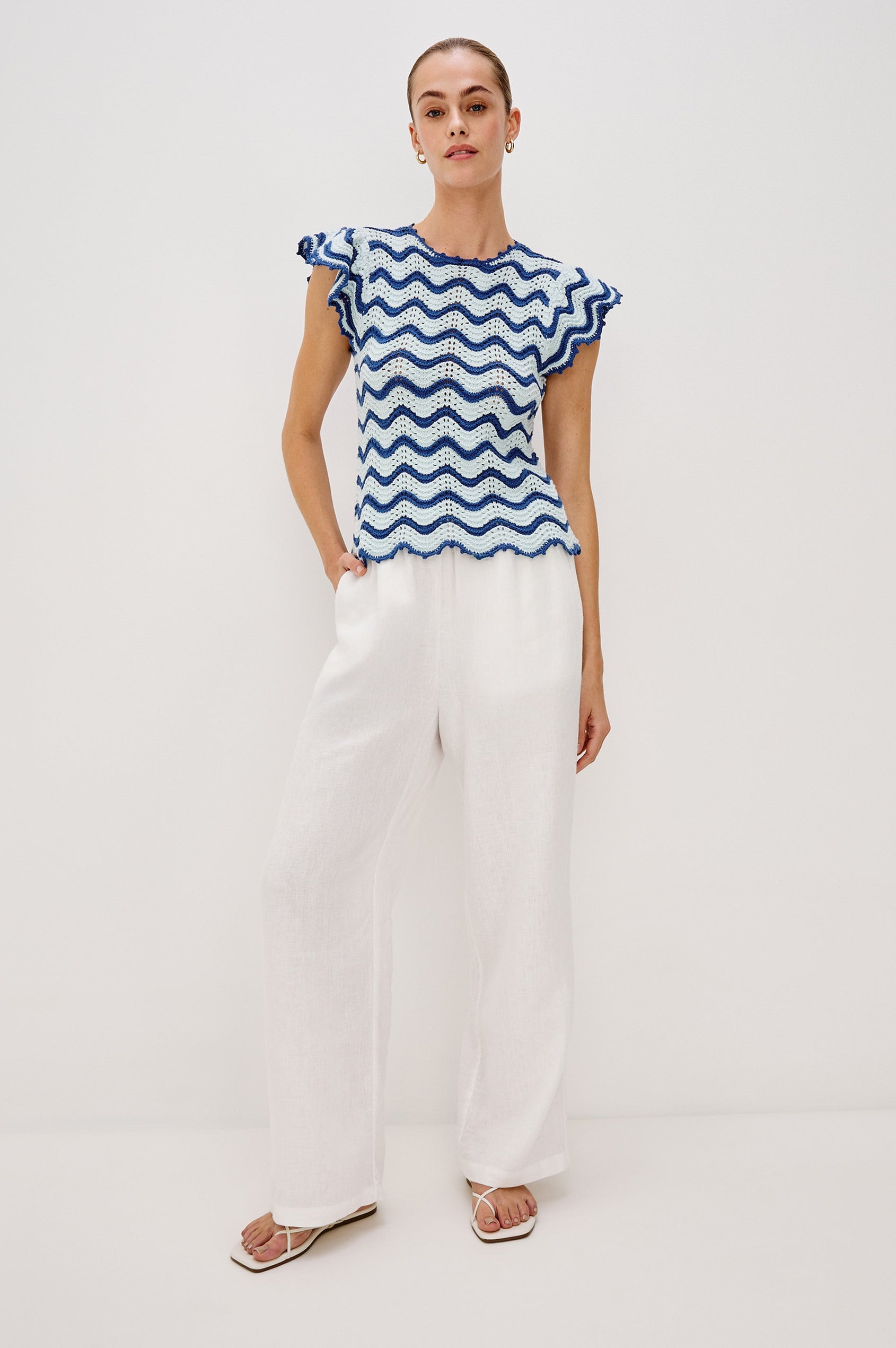 Coen Crew Neck Sweater Top with Short Flutter sleeves, Scalloped Hems in Azure Scallop Colorway. Front View Shown on Model.