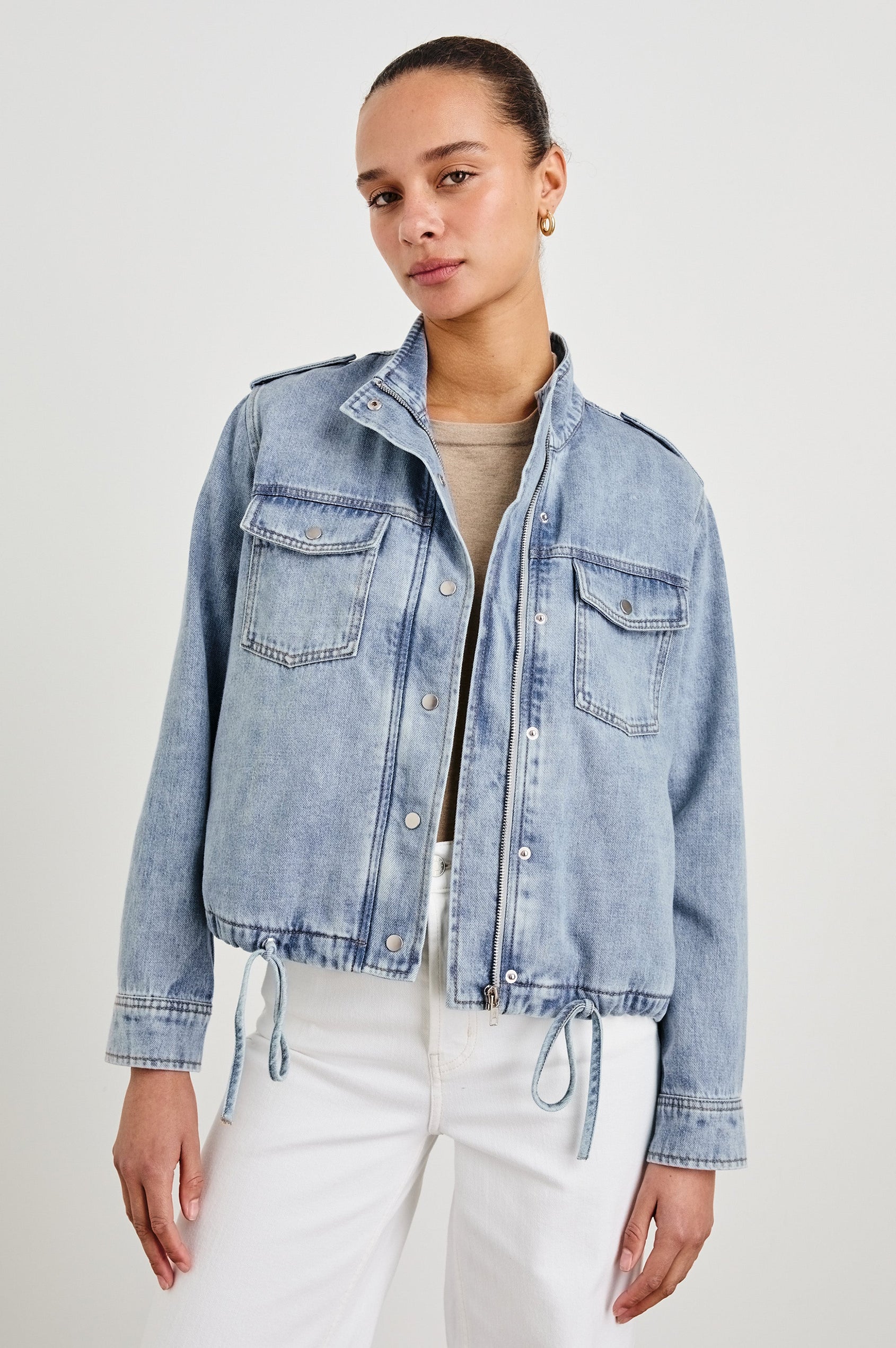 Collins military style jacket with cargo chest pockets and drawstring hem in Faded Indigo -  front view on model