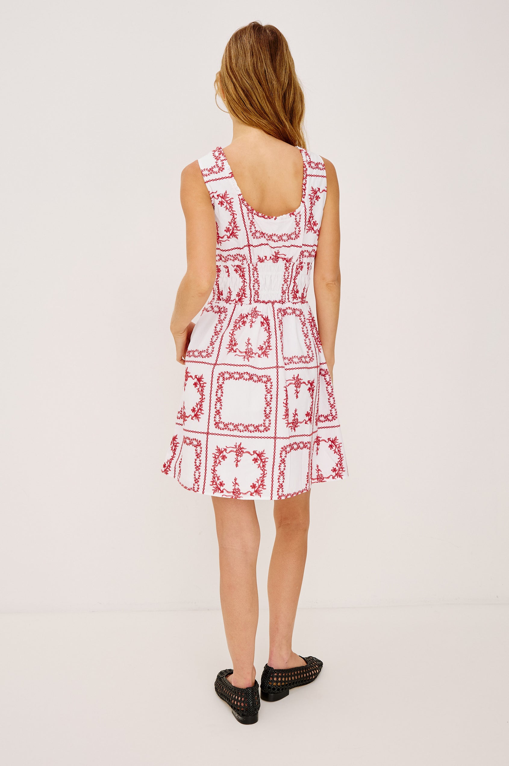 Cosette Mini Dress in Cotton Poplin With Soft Square Neckline, Center-Front Bust Ties, Smocked Waist, Side Pockets, and A-Line Skirt in Red Handkerchief Colorway - Full Body Back View Featured on Model