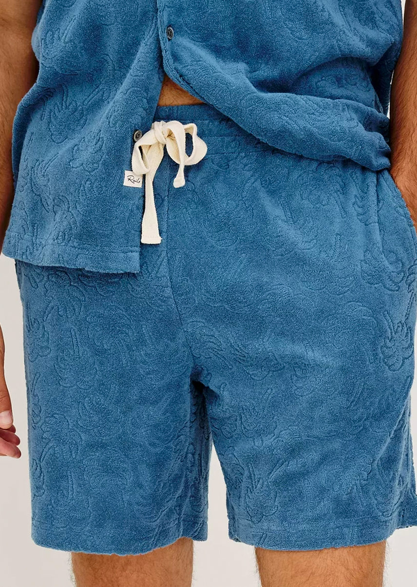 Blue textured shorts with a drawstring on a plain background