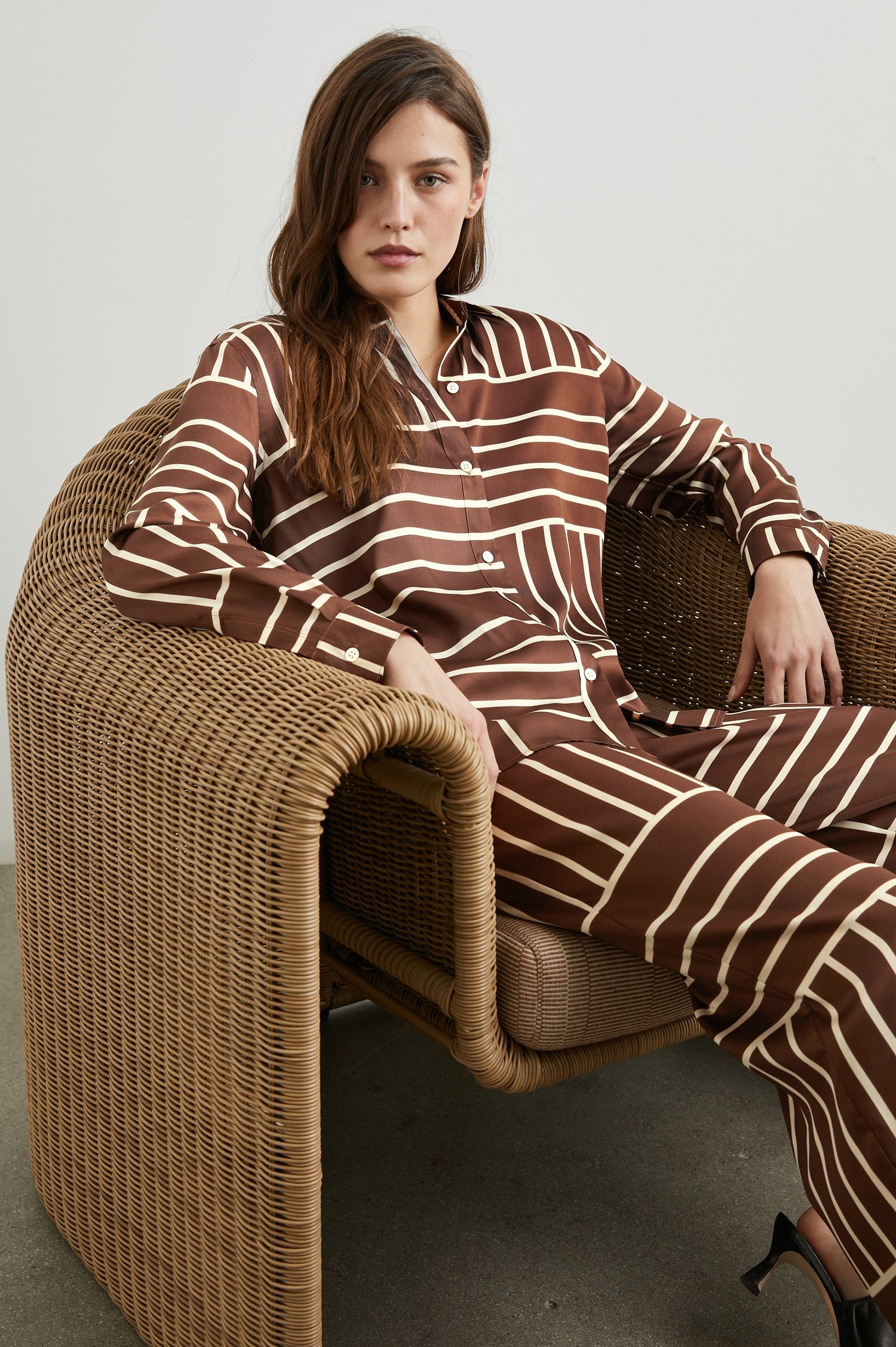 Damini Pants with a Drawstring Waist and Two Front Pockets in Brown Line Art Colorway, white lines on brown - Front Full Body View Featured on Seated Model