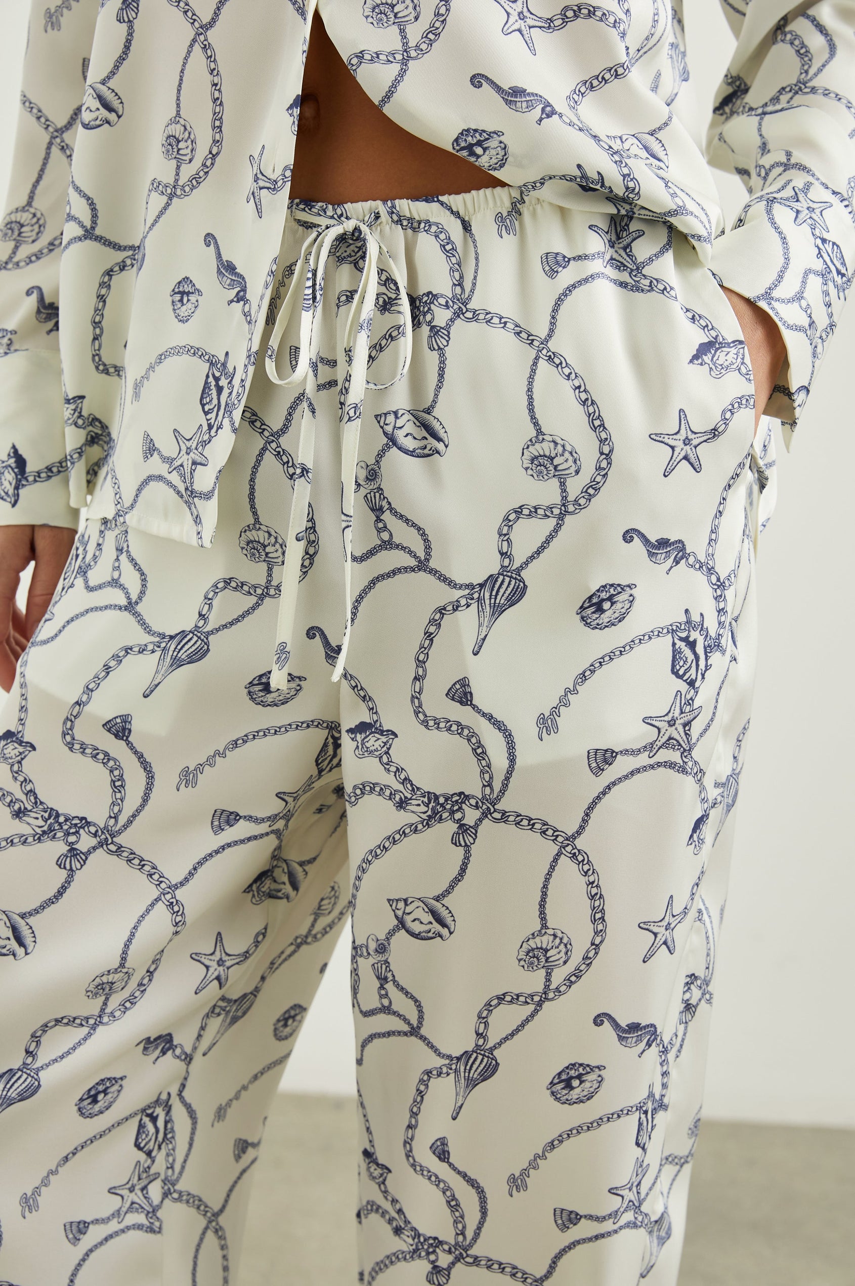 Damini Pants with a Drawstring Waist and Two Front Pockets in Nautical Chain Colorway, with a blue Nautical pattern on white - Front View Featured on Model