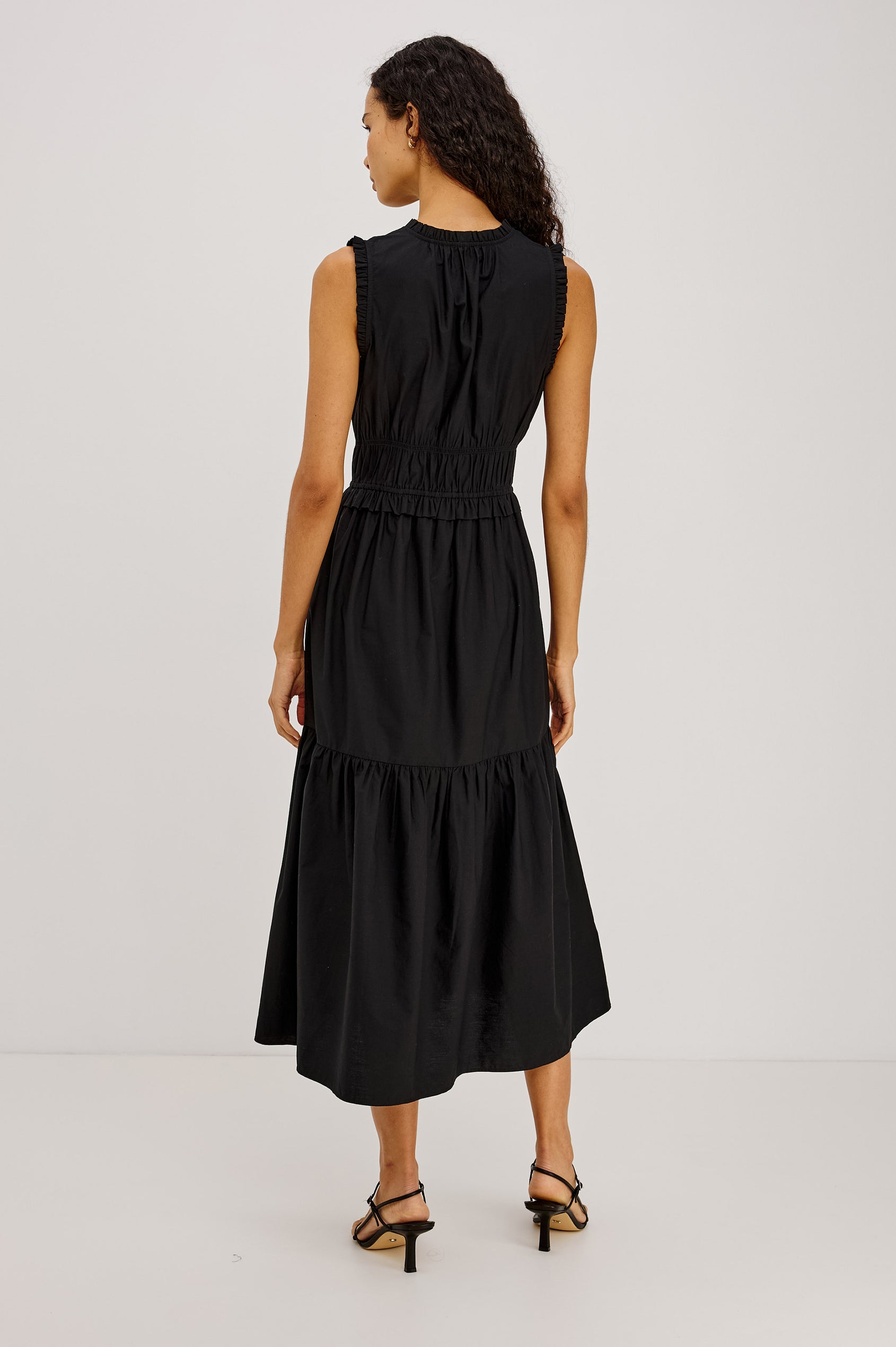 Dana Midi Dress in Cotton Poplin With Deep V-Neck and Center-Front Ties, Laddered Elastic Waist, Fully Lined Tiered Skirt, On-Seam Side Pockets, and Ruffle Trim in Black Colorway - Full Body Back View Featured on Model