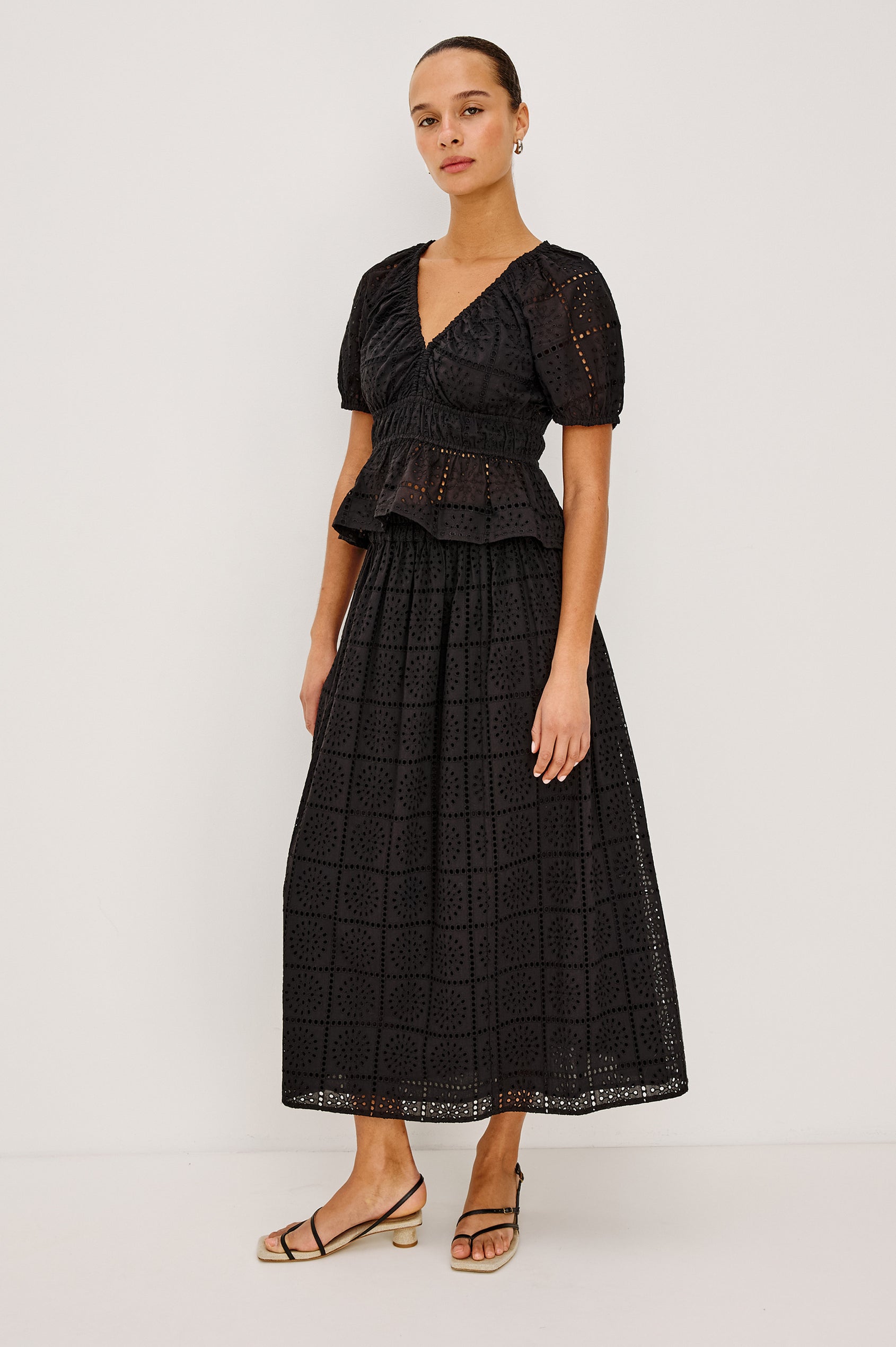 Dax A-Line Maxi Skirt With Grid and Floral Cutwork Embroidery, Elastic Waistband, and is Fully Lined in Black Grid Embroidery Embroidery Colorway - Full Body Front View Featured on Model