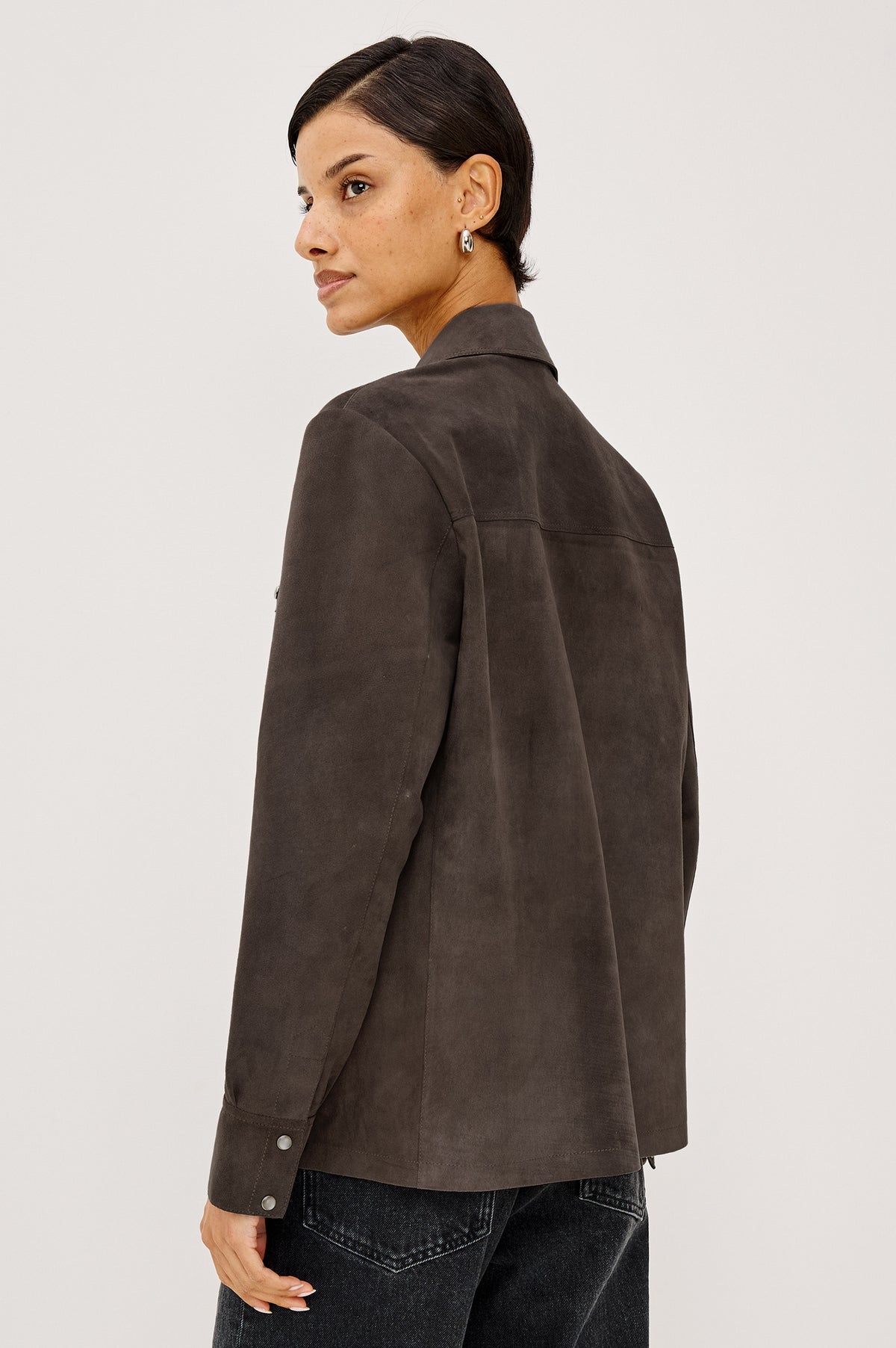 Dean Overshirt in Smooth Suede With Relaxed, Slightly Oversized Fit, Snap-Button Front, Point Collar, Dual Chest Patch Pockets, and Long Sleeves in Espresso Colorway - Upper Body Back View Featured on Model