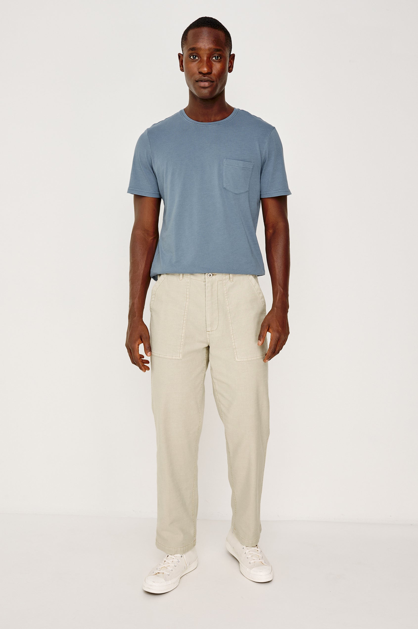 Decker Relaxed Straight Leg Workwear Pant in Stretch Cotton With Lived-In Wash, Zip Fly, and Side and Back Buttoned-Flap Pockets in Natural Colorway - Full Body Front View Featured on Model