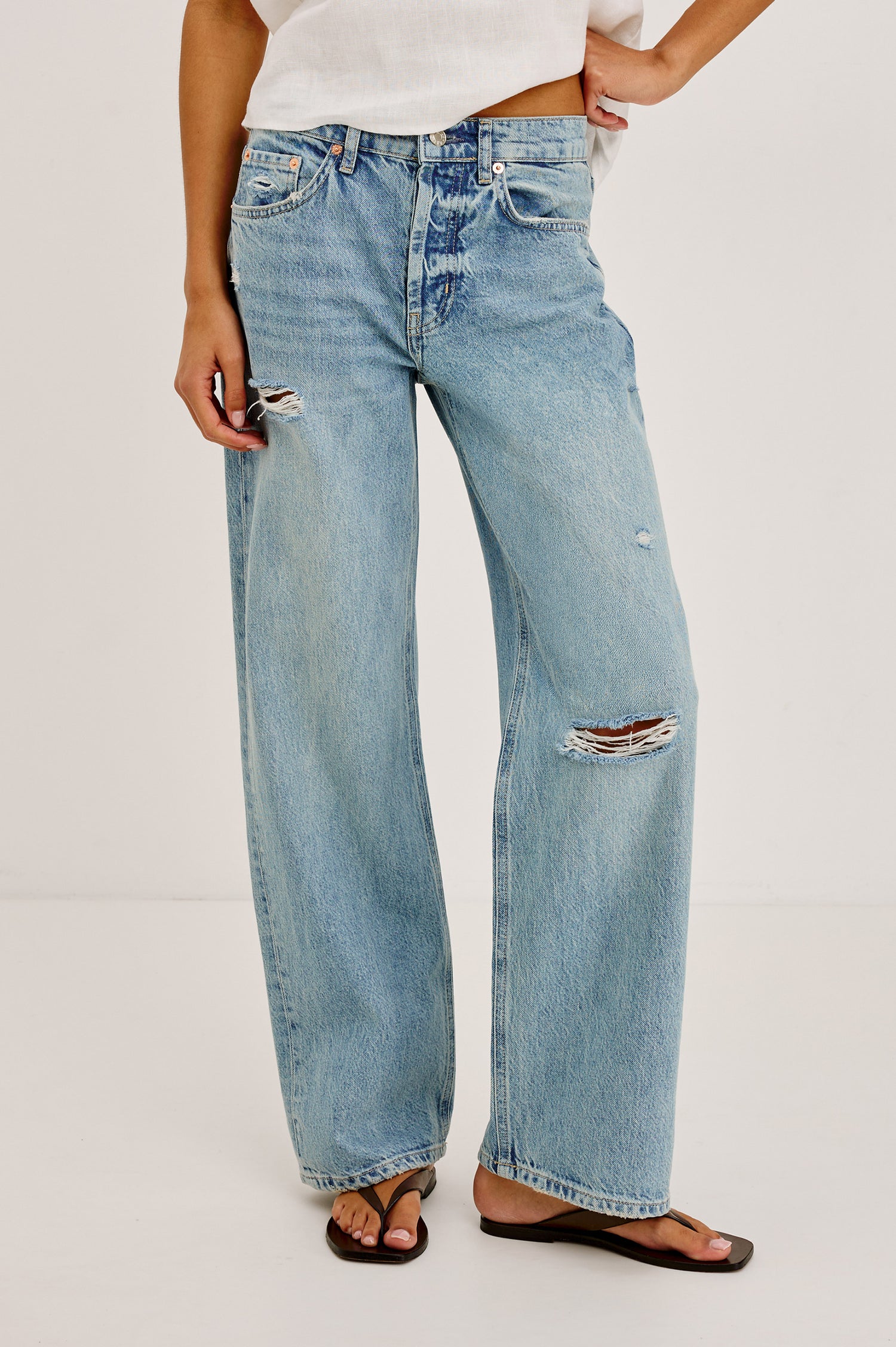 Petite Del Mar Boyfriend Jean With Wide, Relaxed Legs, Distressed Knee and Detailing, and 5-Pocket Vintage-Inspired Design, and Button Fly in Heritage Destructed Colorway - Lower Body Front View Featured on Model