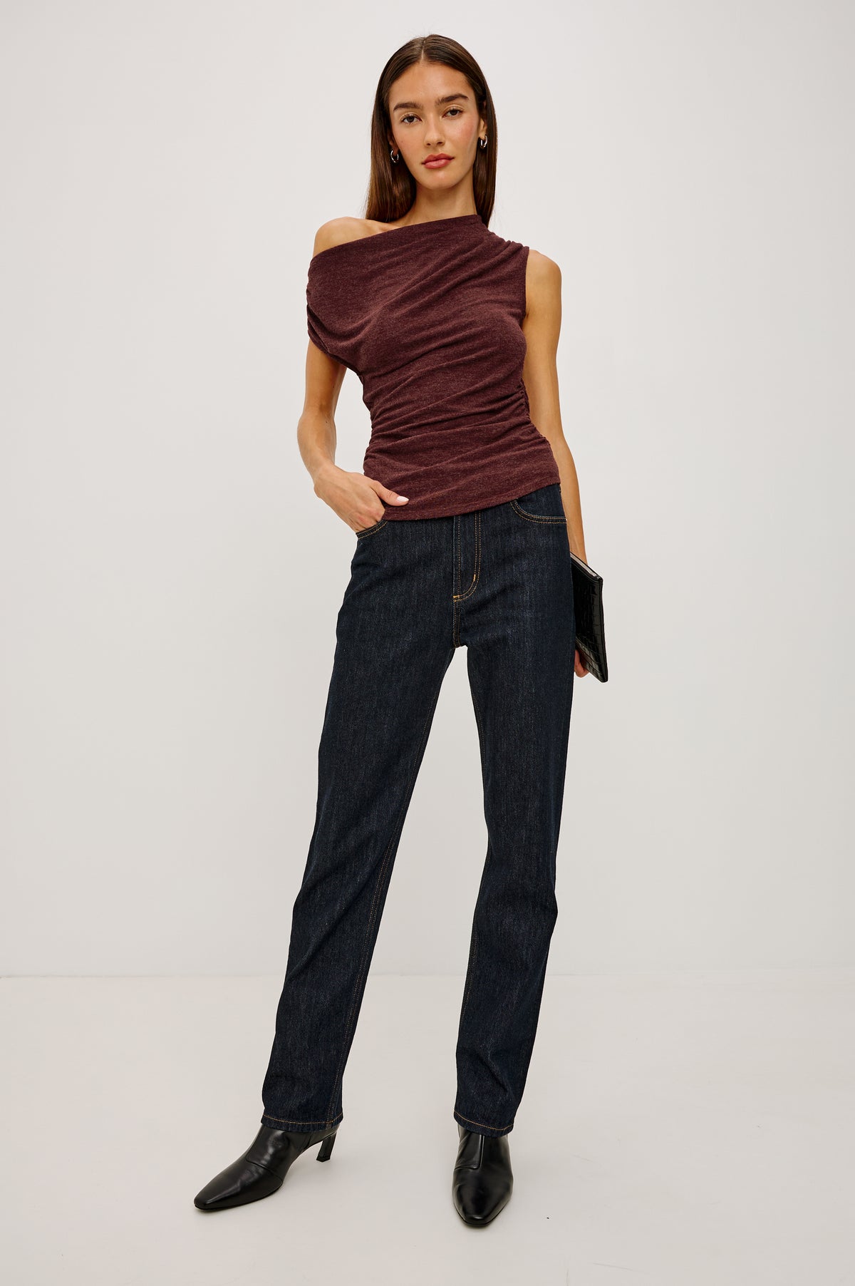 Dominic Top in Soft Jersey With Off-The-Shoulder One-Shoulder Design, Shirred Shoulders, and Ruched Waist in Merlot Colorway - Full Body Front View Featured on Model