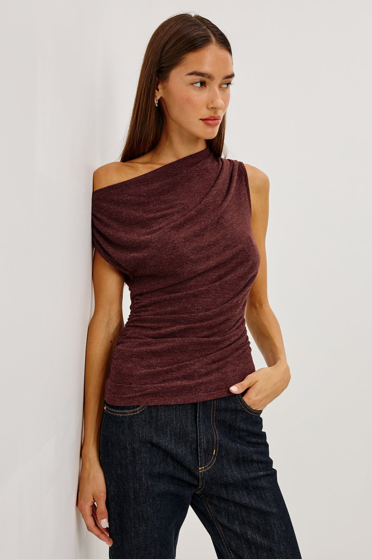 Dominic Top in Soft Jersey With Off-The-Shoulder One-Shoulder Design, Shirred Shoulders, and Ruched Waist in Merlot Colorway - Upper Body Front View Featured on Model