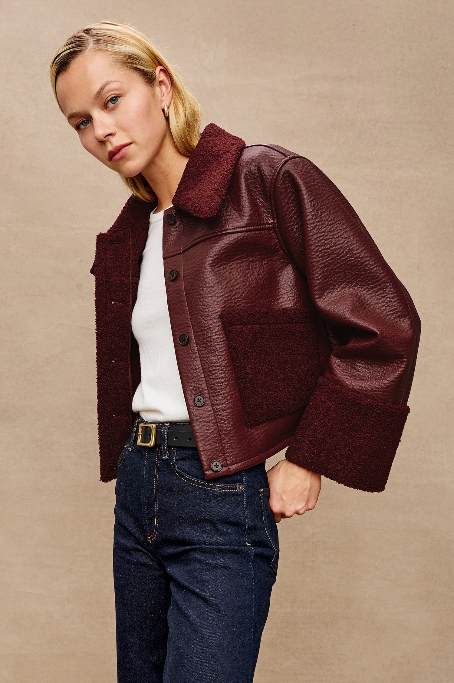 Dria Jacket with Button Closure, Two Front Patch Pockets and Faux Shearling at the Pockets, Cuffs, Collar and Opening in Maroon Shearling Colorway, Front View Featured on Model 