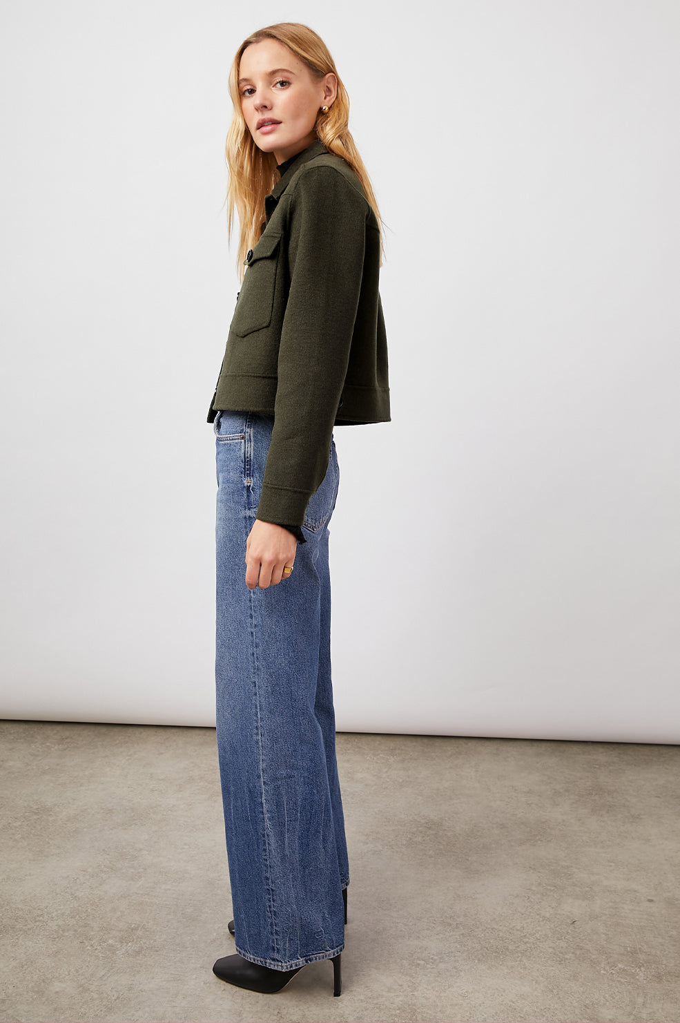 Easton Slightly Cropped Jacket with Button Closure, Two Chest Button Flap Pockets and Western Yokes in Olive Colorway - Front Full Body View Featured on Model