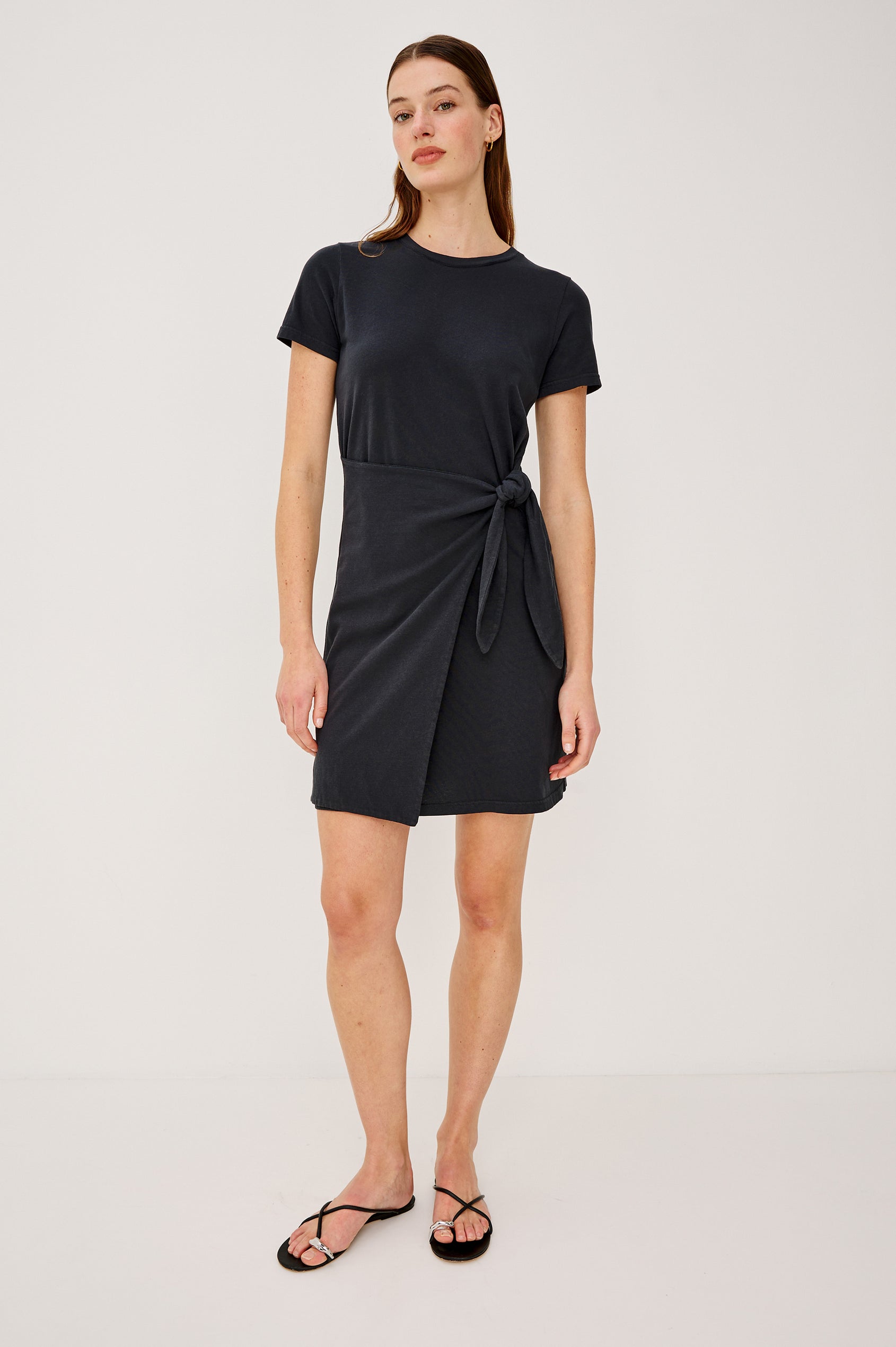 Edie Mini Dress in Sueded Cotton Jersey With Short Sleeves, Crew Neckline, and Adjustable Wrap Waist Ties in Black - Full Body Front View Featured on Model