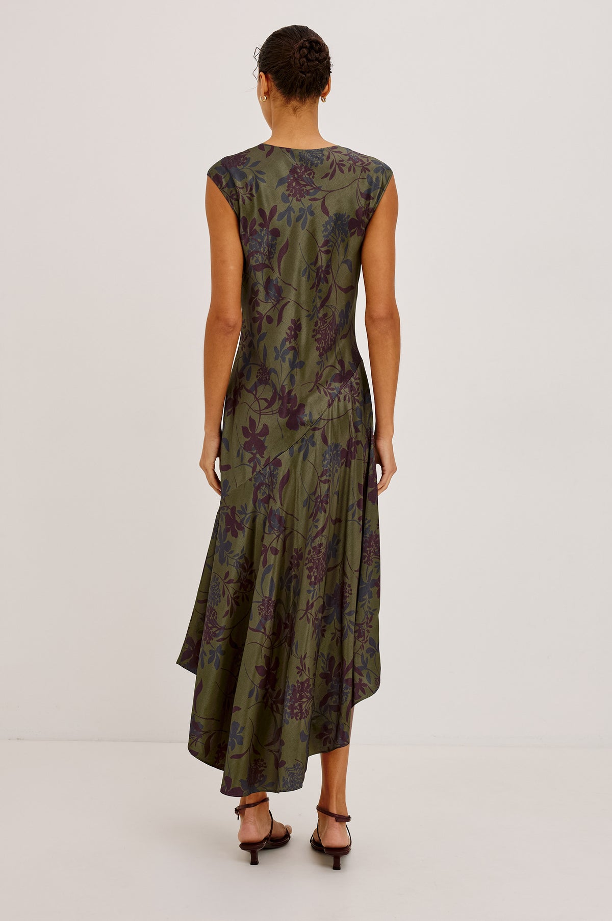 Eleni Dress in Floral Print Satin With V-Neck, Cap Sleeves, and Asymmetric Hem in Olive Dahlia Colorway - Upper Body Back View Featured on Model.