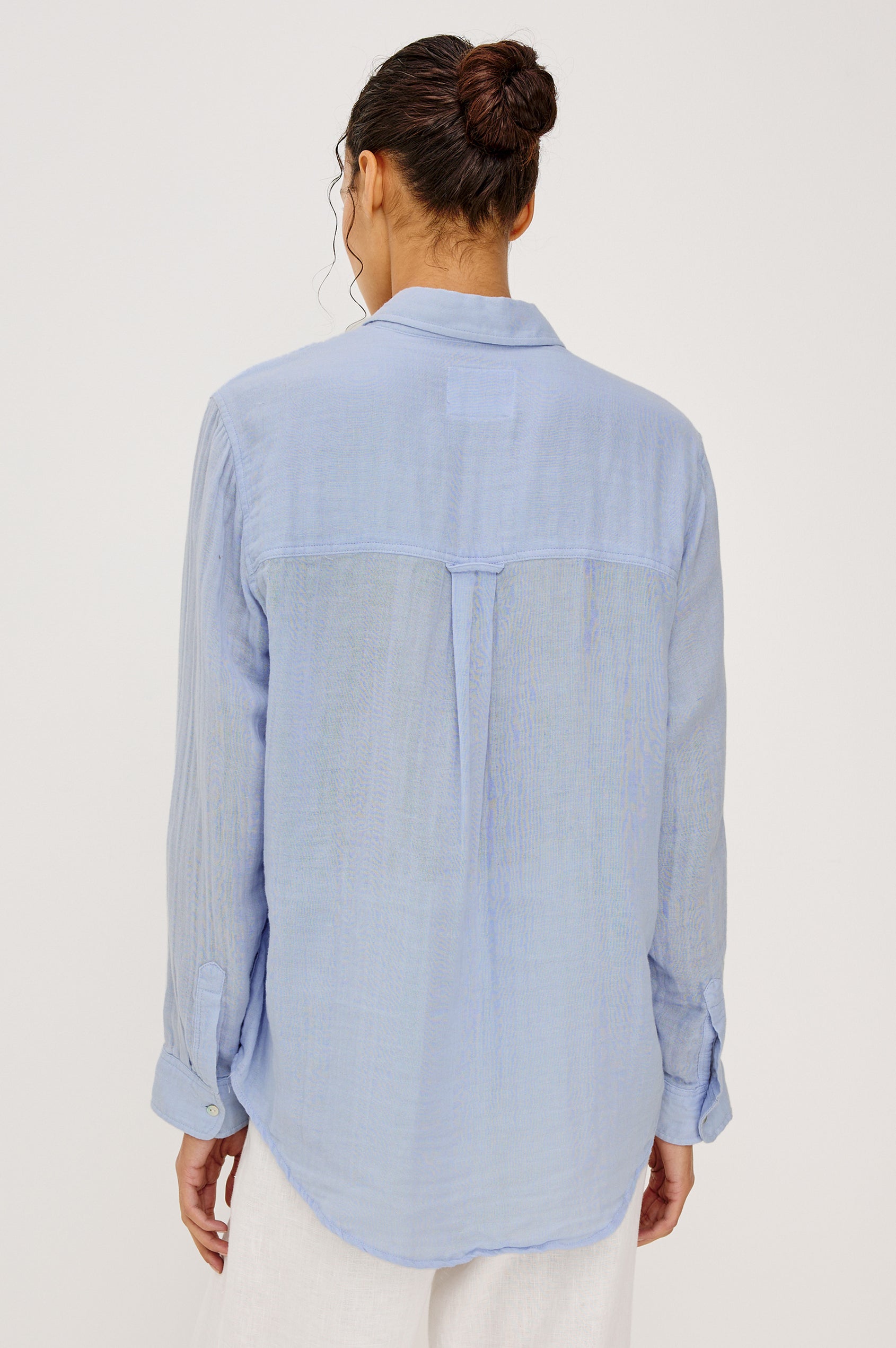 Ellis Relaxed Collared Button Front Shirt with Long Sleeves and a Chest Pocket in Baby Blue Colorway. Upper Body Back View Shown on Model.