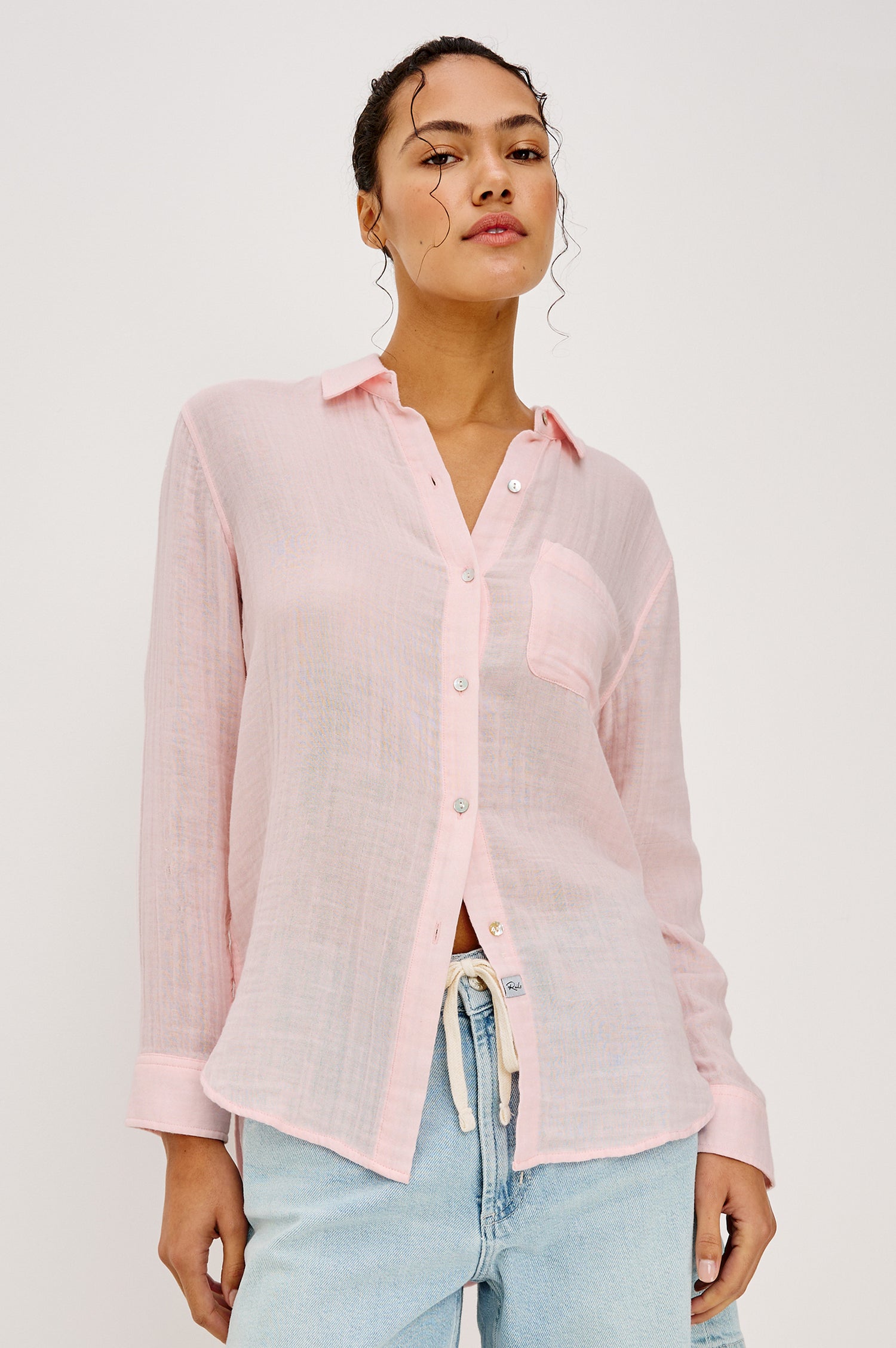 Ellis Relaxed Collared Button Front Shirt with Long Sleeves and a Chest Pocket in Baby Pink Colorway. Upper Body Front View Details Shown on Model.