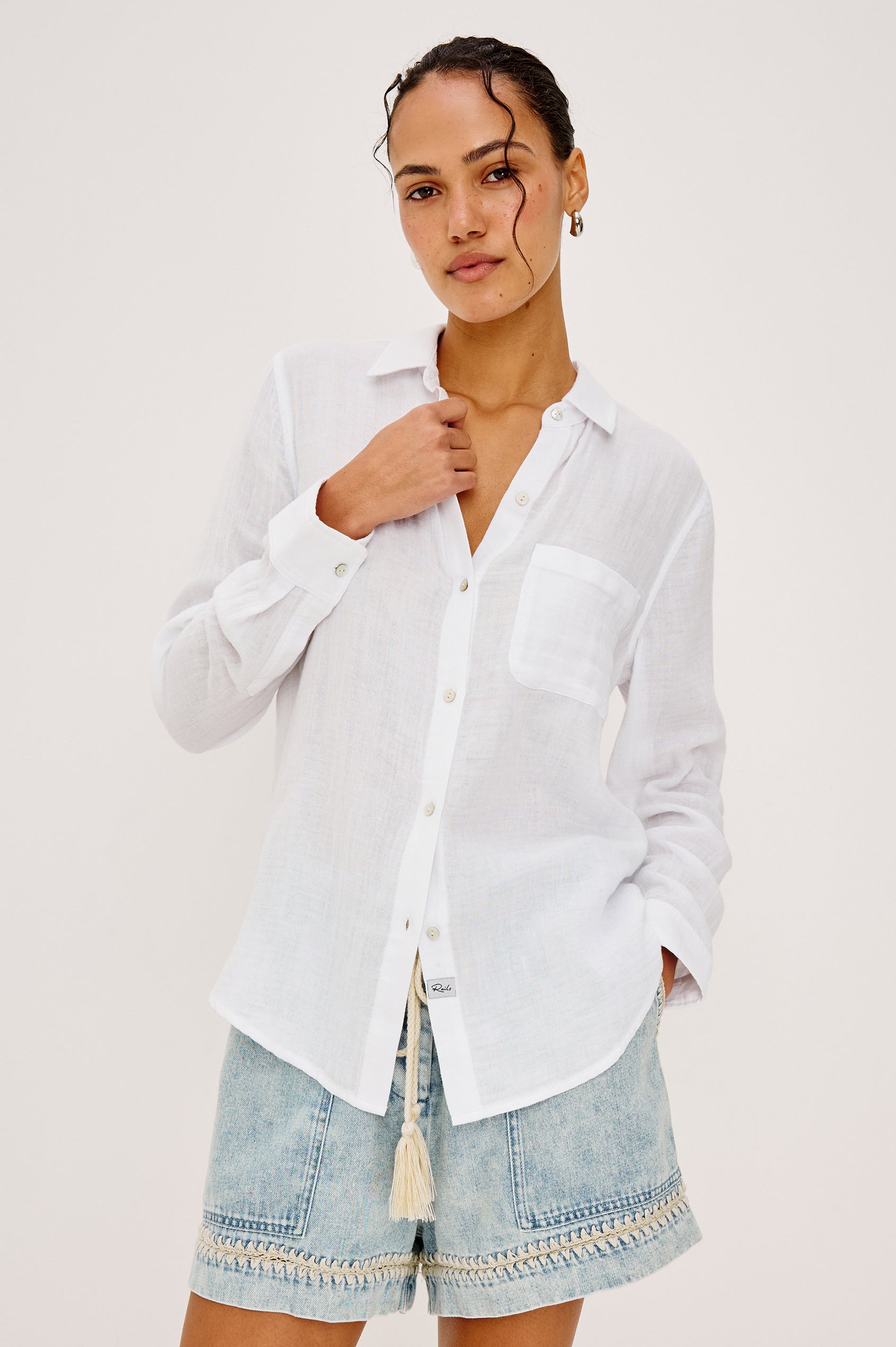 Ellis Relaxed Collared Button Front Shirt with Long Sleeves and a Chest Pocket in White Colorway. Upper Body Front View Shown on Model.