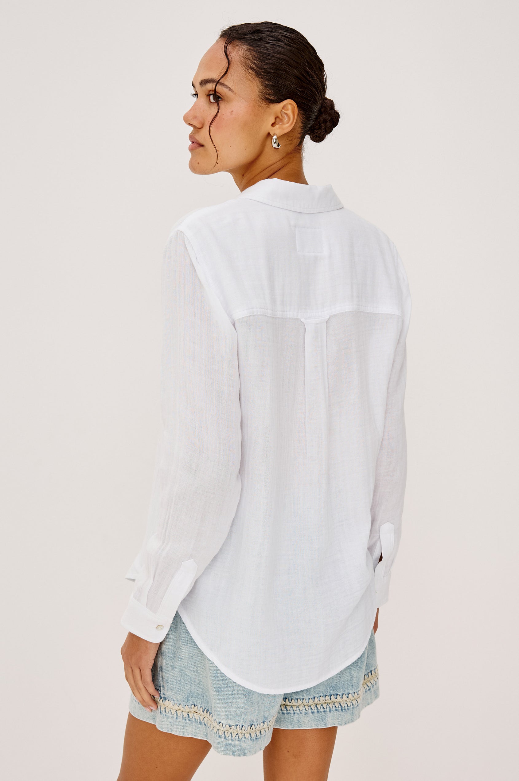 Ellis Relaxed Collared Button Front Shirt with Long Sleeves and a Chest Pocket in White Colorway. Upper Body Back View Shown on Model.