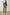 Emmerson Pants with a Drawstring Waist, Two Front Pockets, Two Side Flap Pockets and Two Back Welt Pockets in Olive Colorway - Back View Featured on Model