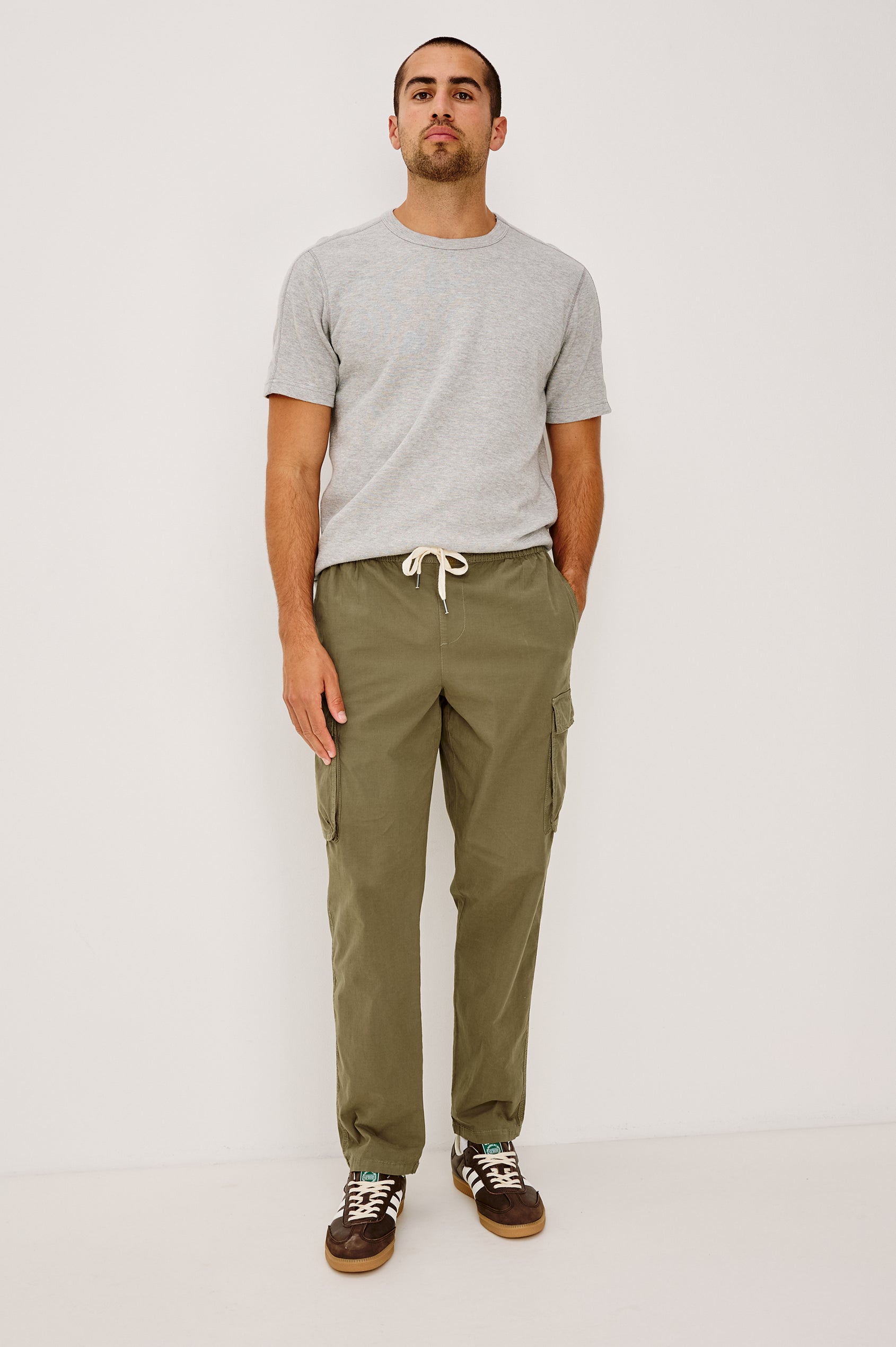 Emmerson Pant in Lightweight Cotton With Cargo Pockets and Drawstring Waist in Olive Colorway - Full Body Front View Featured on Model