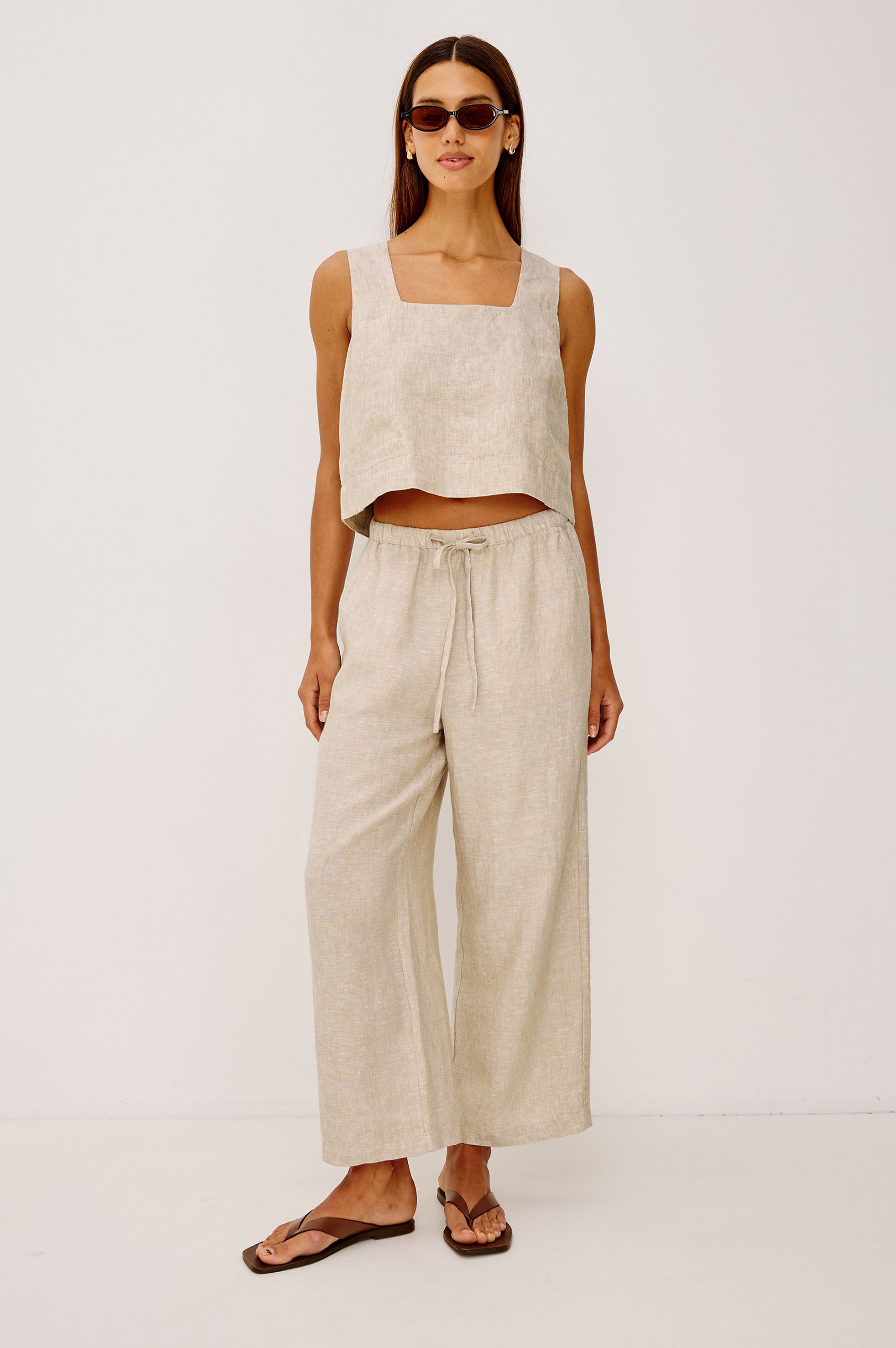 Emmie Crop Pant in Linen With Straight Legs, Adjustable Drawstring Waist Ties, and Side Pockets in Heathered Flax Colorway - Full Body Front View Featured on Model