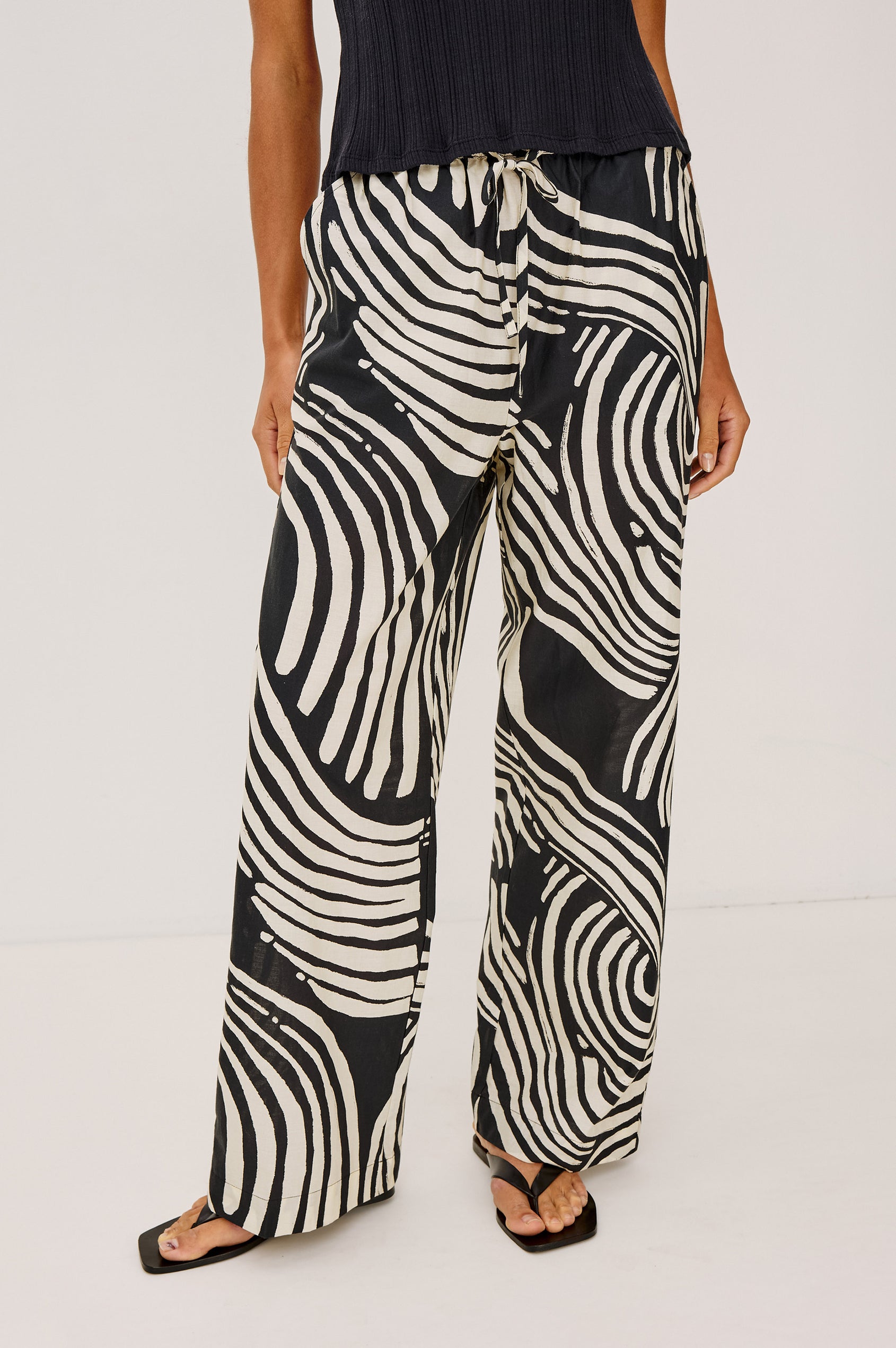 Emmie Pant in Cotton Voile With Straight Legs, Adjustable Drawstring Waist Ties, and Side Pockets in Onyx Waves Colorway - Lower Body Front View Featured on Model