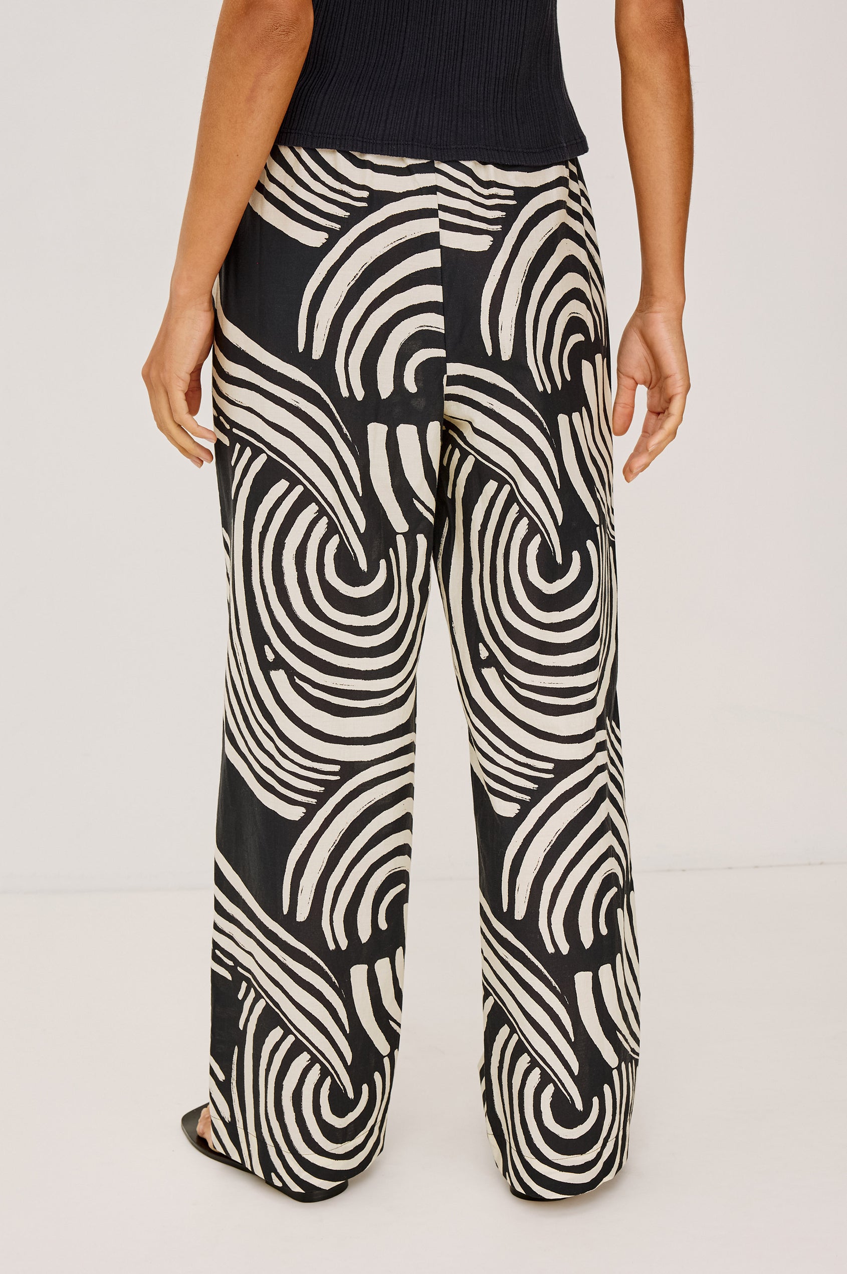 Emmie Pant in Cotton Voile With Straight Legs, Adjustable Drawstring Waist Ties, and Side Pockets in Onyx Waves Colorway - Lower Body Back View Featured on Model