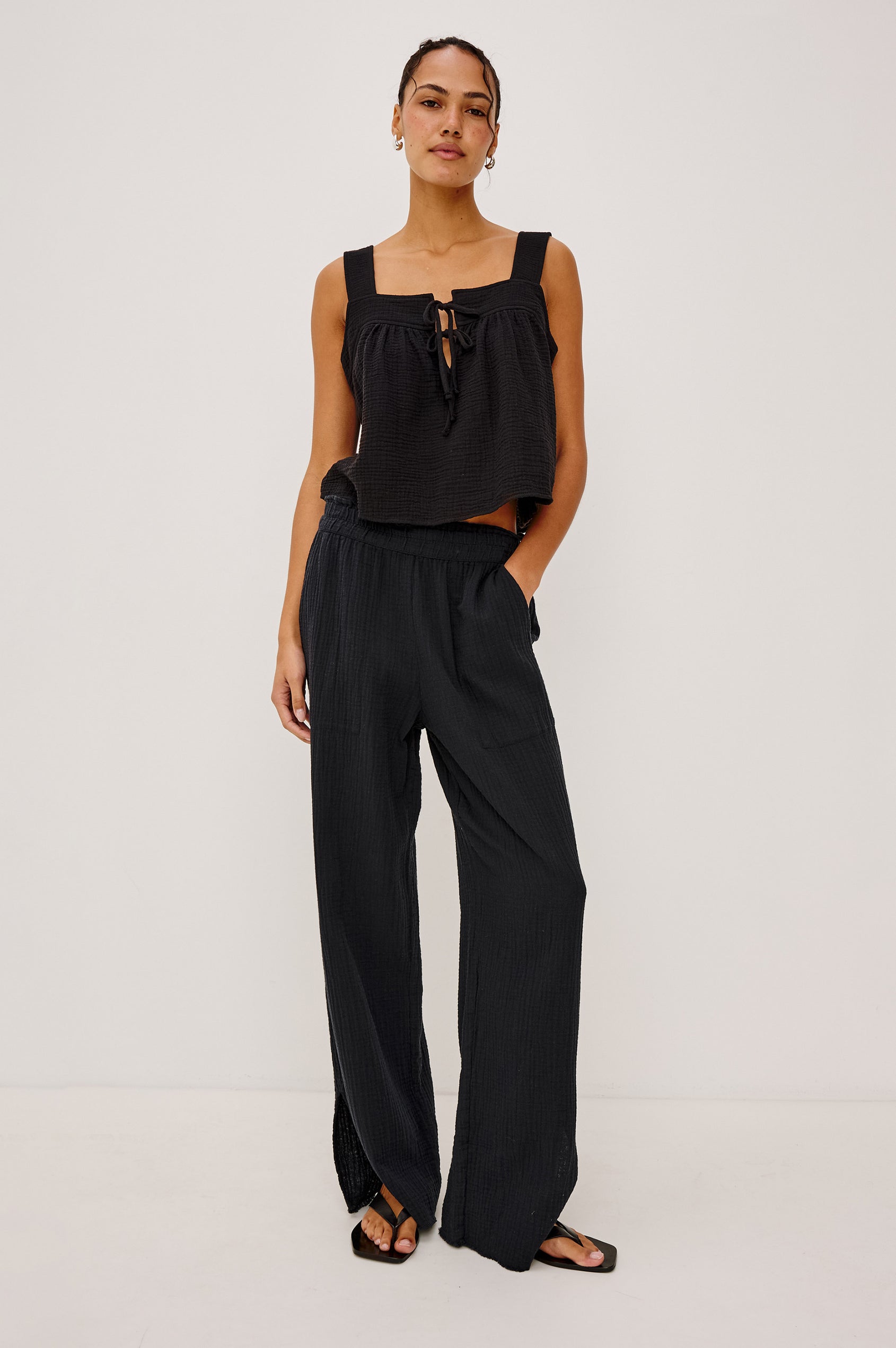 Enya Cropped Tank Top with a Square Neck with a V Cutout with Ties in Black Gauze Colorway - Front View Featured on Model