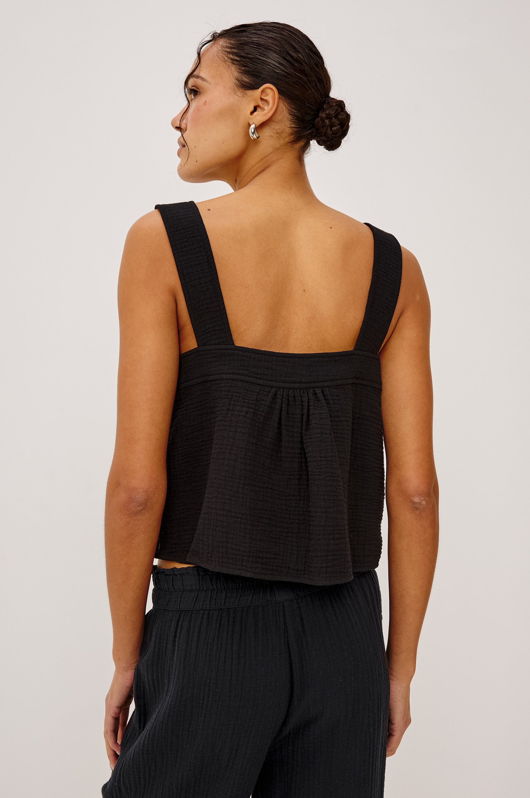 Enya Cropped Tank Top with a Square Neck with a V Cutout with Ties in Black Gauze Colorway - Front View Featured on Model