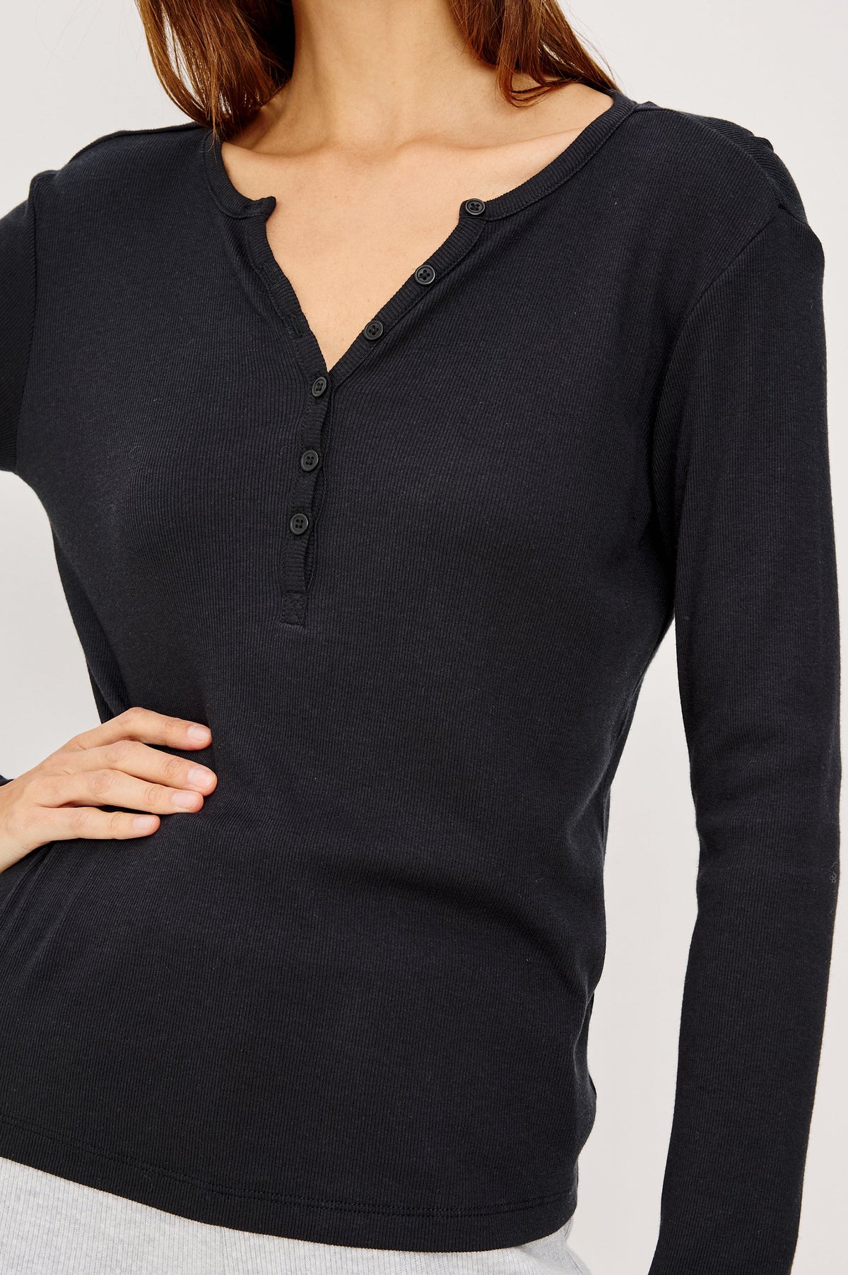 Essential Ribbed Henley With Front Placket and Long Sleeves in Black Colorway - Upper Body Close Up Front View Featured on Model