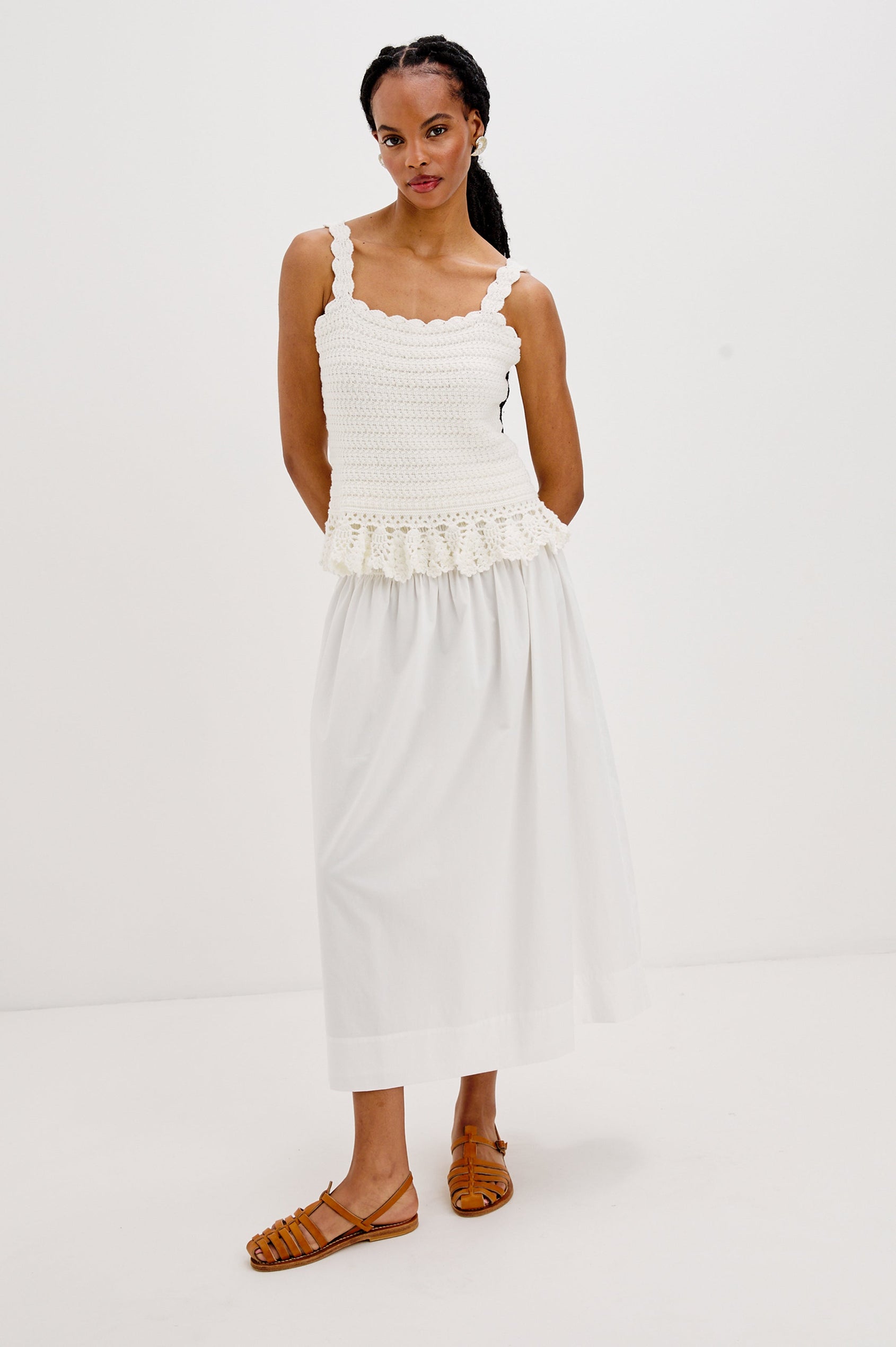 Estefania Tank Top with Scalloped Straps and a Small Peplum Embroidered Ruffle Hem in White Colorway. Full Body Front View Shown on Model.