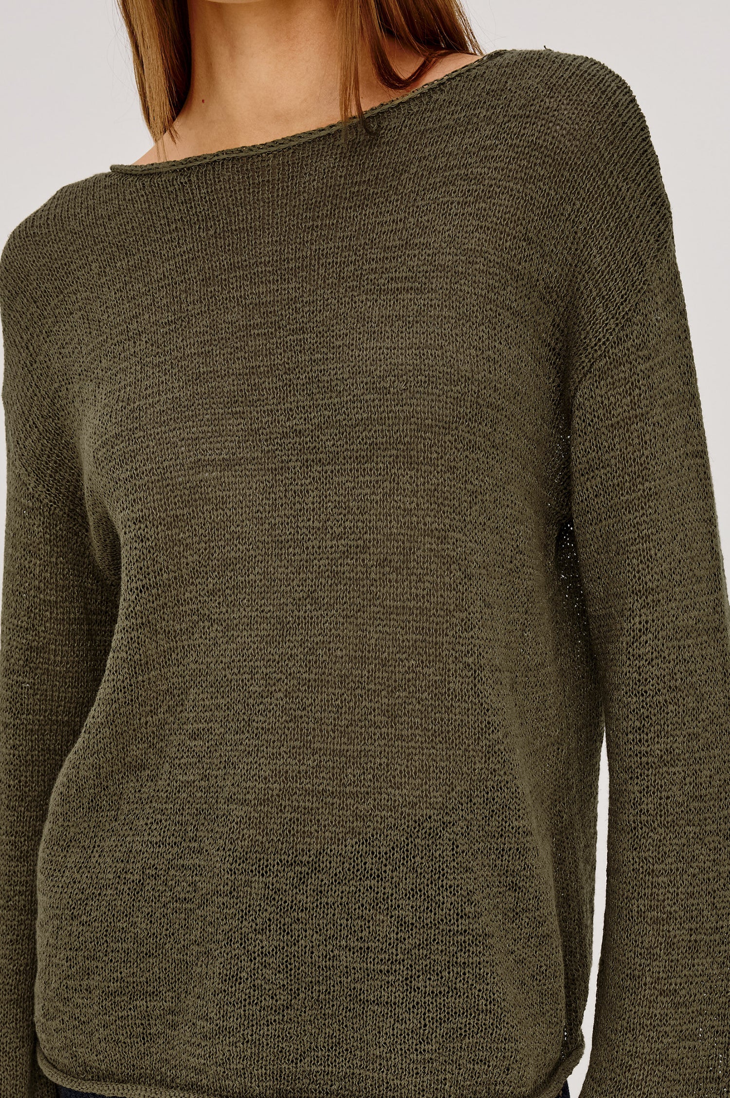 Evangeline Sweater in Luxe Linen Blend With Open Weave, Boat Neck, Relaxed Dropped Shoulders, and Long Sleeves in Olive Colorway - Upper Body Front View Featured on Model