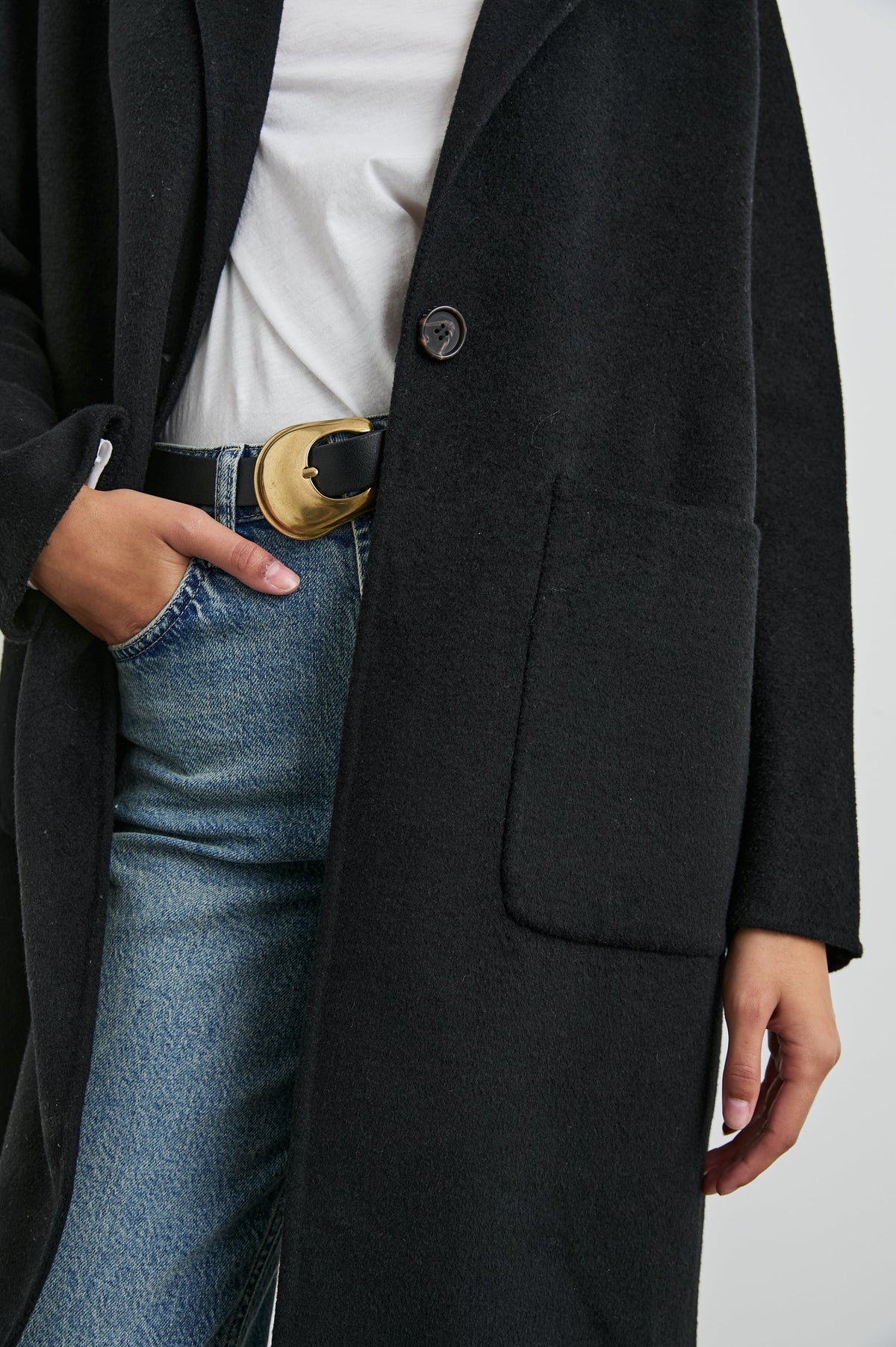 Everest Mid-Thigh Length Coat with Single Button Closure, Notched Lapels and Front Patch Pockets in Black Colorway - Front View Featured on Model