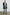 Everest Mid-Thigh Length Coat with Single Button Closure, Notched Lapels and Front Patch Pockets in Black Colorway - Front Full Body View Featured on Model