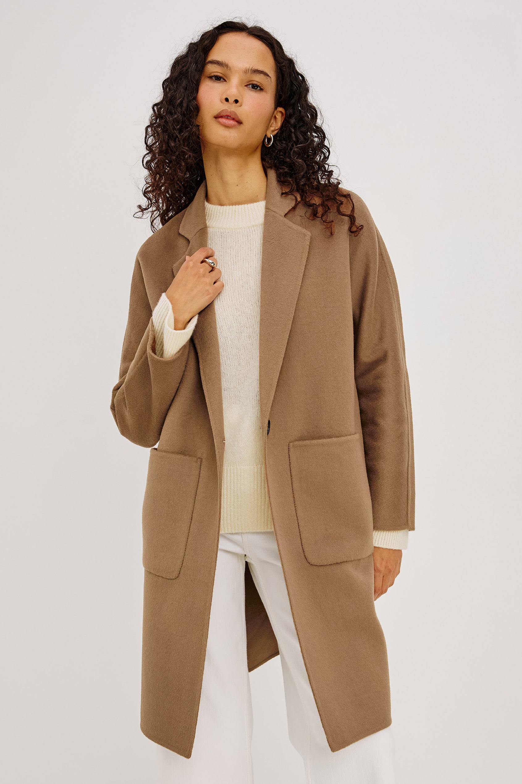 Everest Coat in Heavy Wool Blend With Longline Cut, Slightly Oversized Relaxed Fit, Lapel Collar, Single-Button Front, and Front Patch Pockets in Oat Camel Colorway - Upper Body Front View Featured on Model