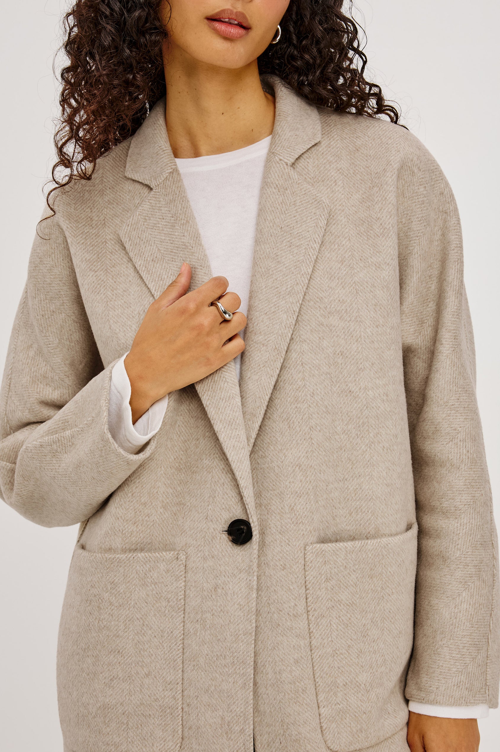 Everest Coat in Heavy Wool Blend With Longline Cut, Slightly Oversized Relaxed Fit, Lapel Collar, Single-Button Front, and Front Patch Pockets in Oat Herringbone Colorway - Full Body Back View Featured on Model