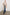 Everest Mid-Thigh Length Coat with Single Button Closure, Notched Lapels and Front Patch Pockets in Oatmeal Colorway - Front Full Body View Featured on Model