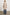 Everest Mid-Thigh Length Coat with Single Button Closure, Notched Lapels and Front Patch Pockets in Oatmeal Colorway - Back Full Body View Featured on Model