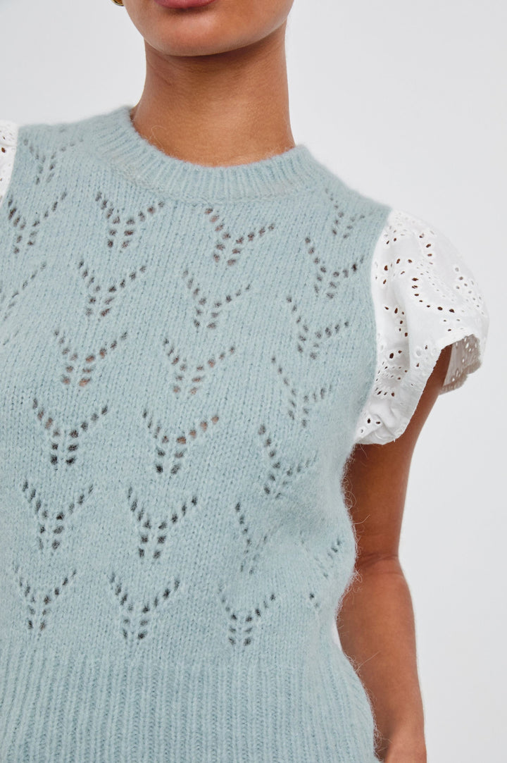 Everly Top with a Knit Bodice with Ribbed Trim and a Crew Neck and White Cotton Short Sleeves with Eyelets In Sky Colorway - Front View Featured on Model