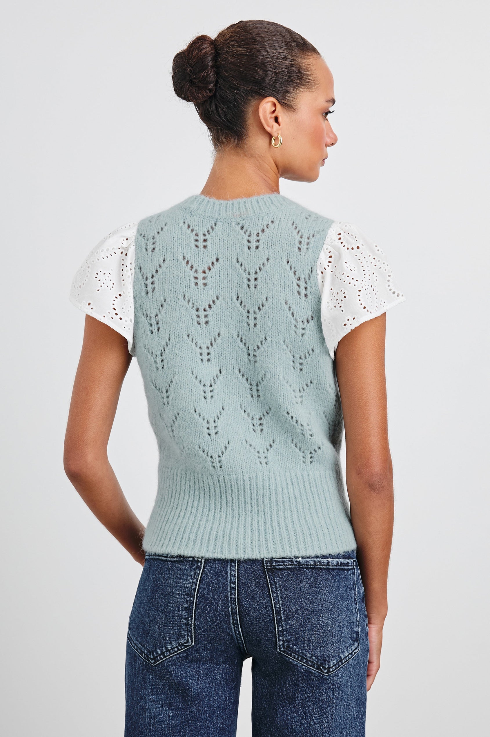 Everly Top with a Knit Bodice with Ribbed Trim and a Crew Neck and White Cotton Short Sleeves with Eyelets In Sky Colorway - Back View Featured on Model