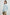 Fable Long Sleeve Top with a V Neck with a Placket, Buttoned Cuffs, and Pleating Down From the Yoke in Light Vintage Colorway, a Blue - Back View Featured on Model 