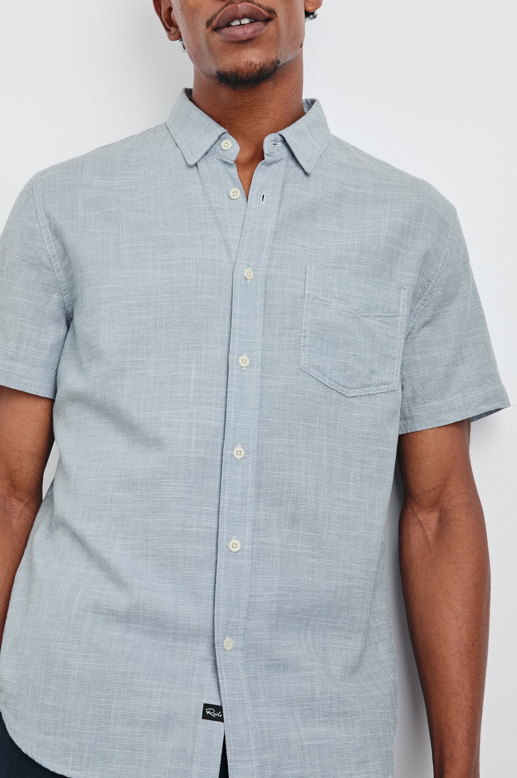 Fairfax short sleeve relaxed fit button up shirt with collar and chest pocket in 
Tidal Etch - close up of details on model
