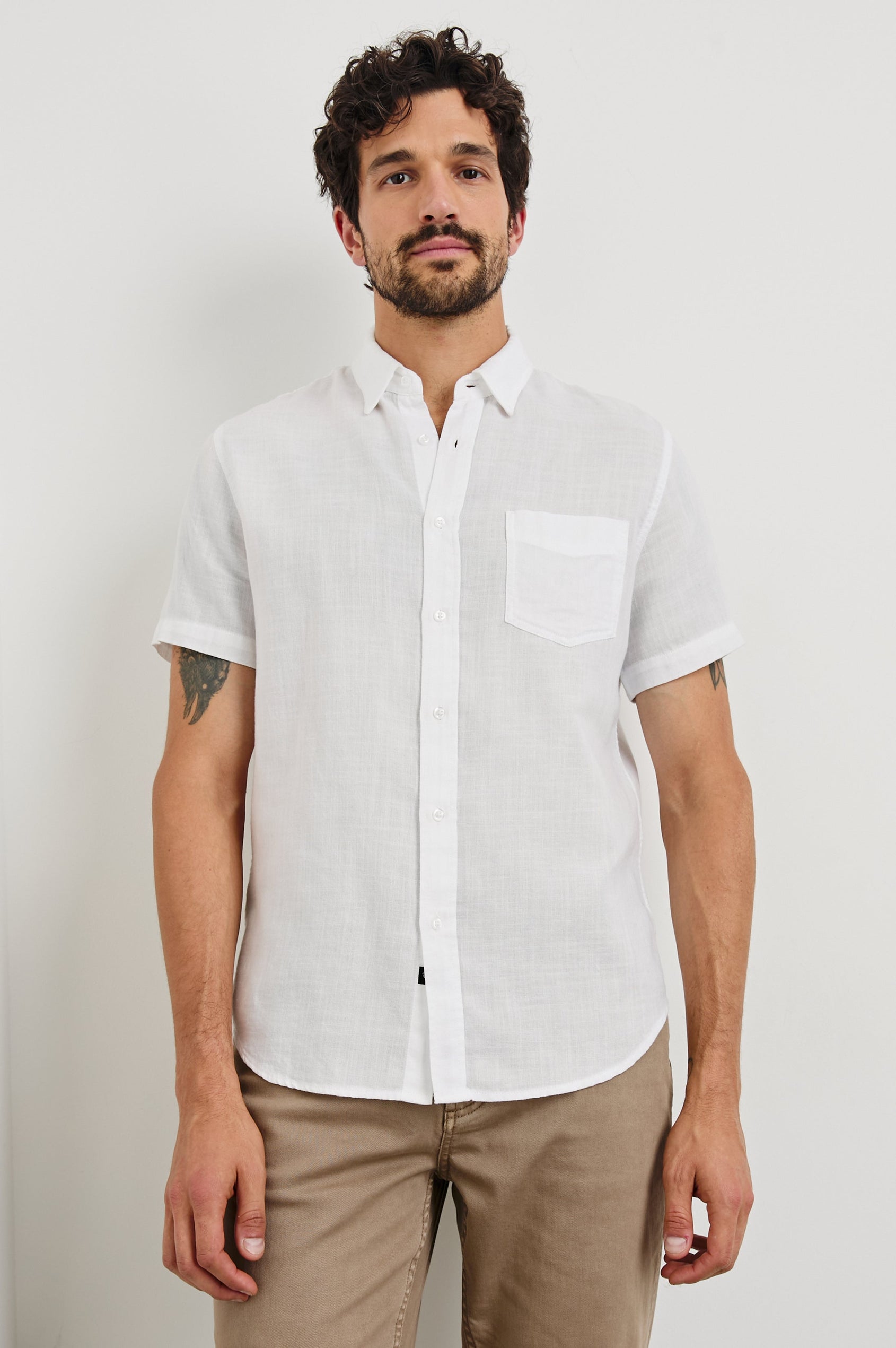 Fairfax short sleeve relaxed fit button up shirt with collar and chest pocket in White - front view on model