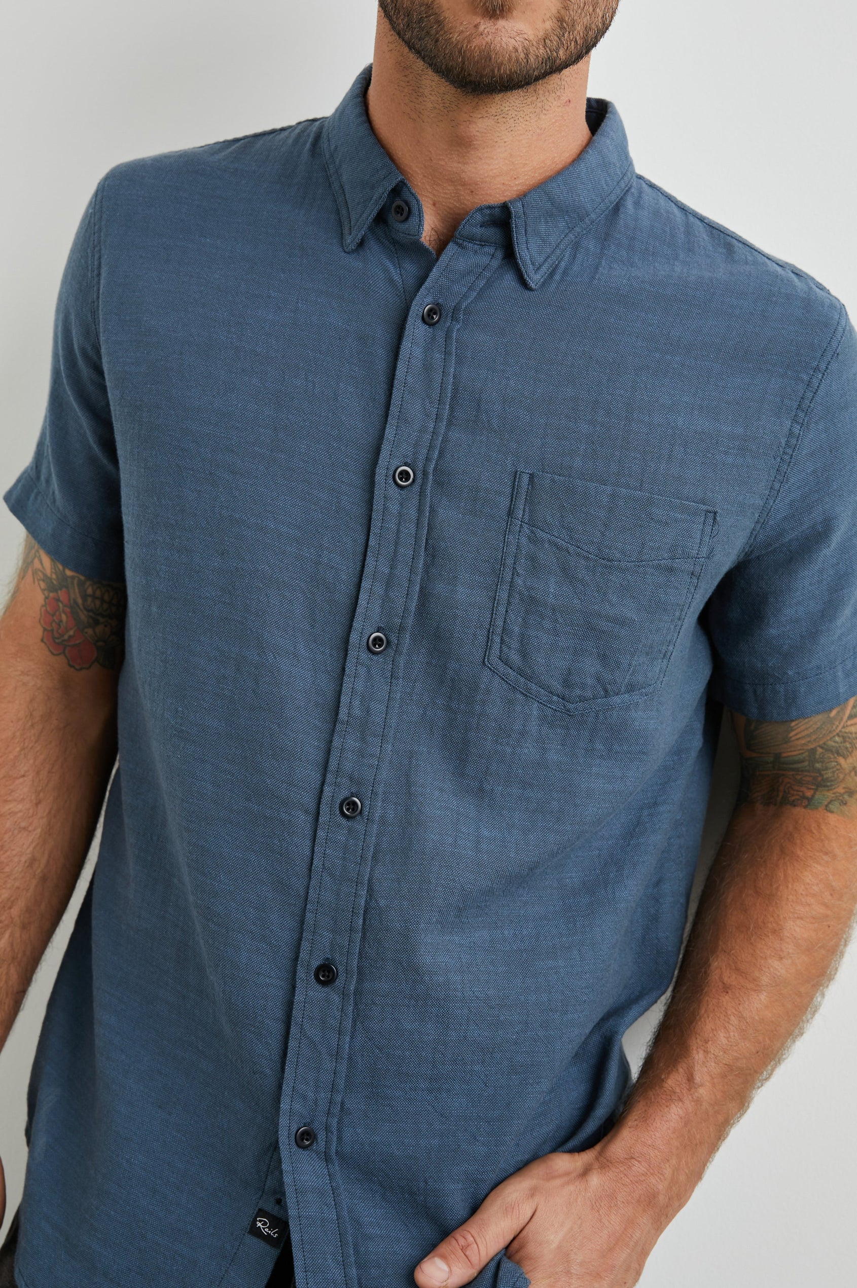 Fairfax Short-Sleeve Button Up with a Chest Patch Pocket in Sea Blue Colorway - Front View Featured on Model