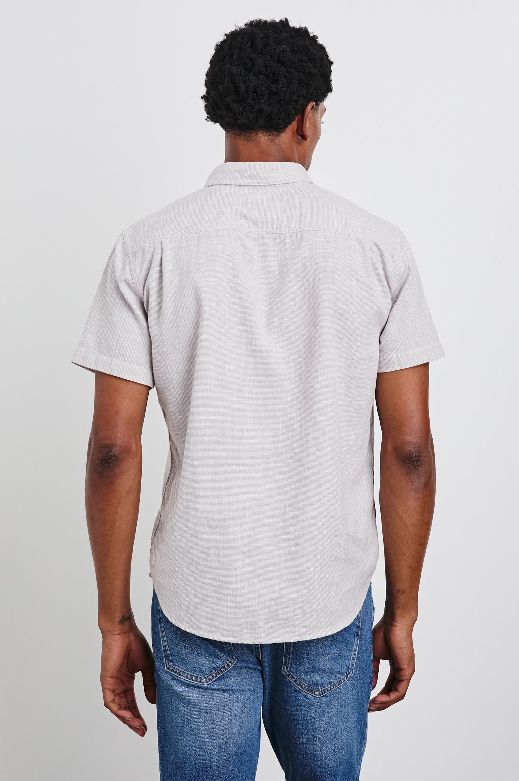 Fairfax Short-Sleeve Button Up with a Chest Patch Pocket in Tahini Etch Colorway - Back View Featured on Model