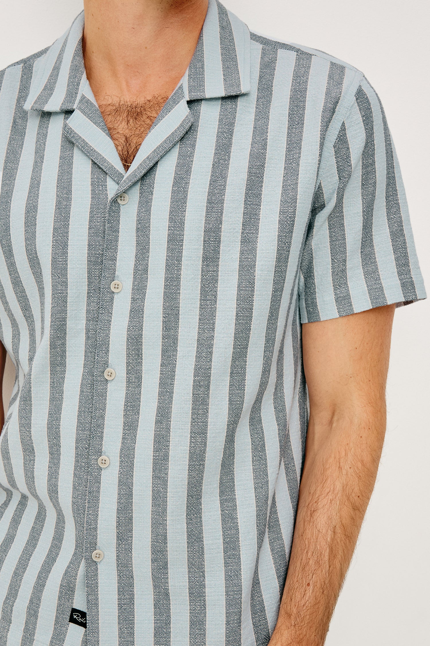 Fielder Camp Shirt With Front Buttons, Short Sleeves, and Relaxed, Boxy Fit in Blue Jay Stripe Colorway - Upper Body Front View Featured on Model