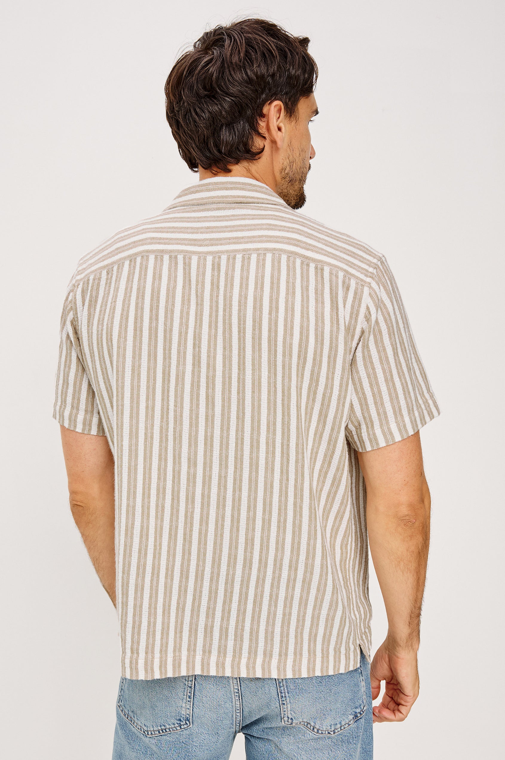 Fielder Camp Shirt With Front Buttons, Short Sleeves, and Relaxed, Boxy Fit in Khaki White Stripe Colorway - Upper Body Back View Featured on Model