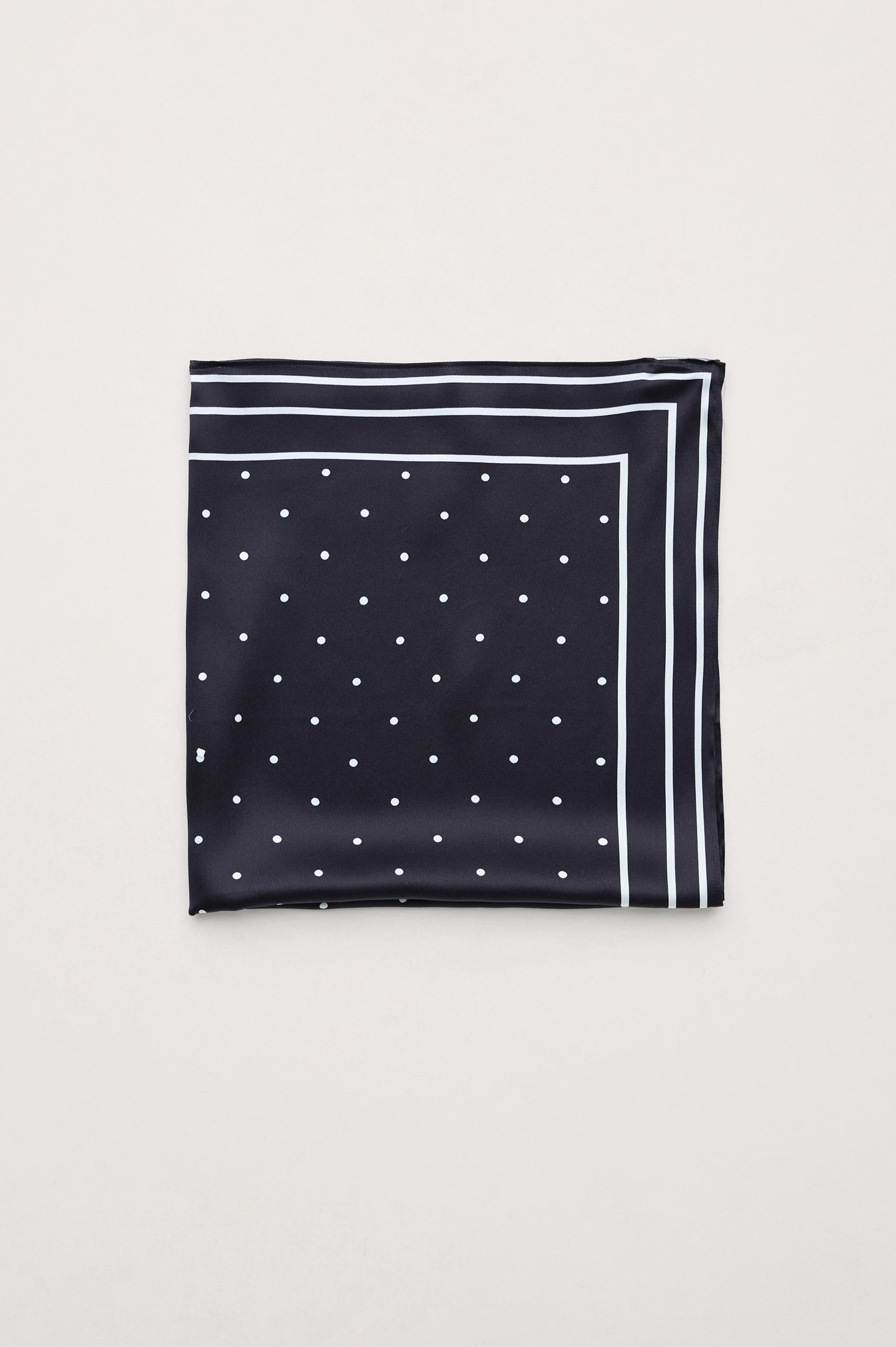 Finna Square Scarf in 100% Silk With Contrast Polka Dots and Striped Outline in Black Colorway - Folded Flat Lay View Featured